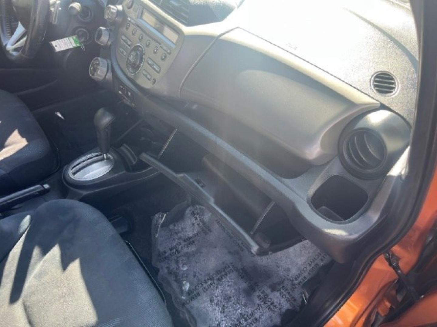 2009 Orange Revolution Metallic /Black Cloth Interior Honda Fit Sport 5-Speed AT (JHMGE88409S) with an 1.5L L4 SOHC 16V engine, 5-Speed Automatic transmission, located at 1865 East Red Hills Pkwy, St. George, 84770, (435) 628-0023, 37.120850, -113.543640 - We specialize in helping ALL people get the best financing available. No matter your credit score, good, bad or none we can get you an amazing rate. Had a bankruptcy, divorce, or repossessions? We give you the green light to get your credit back on the road. Low down and affordable payments that fit- Photo#27
