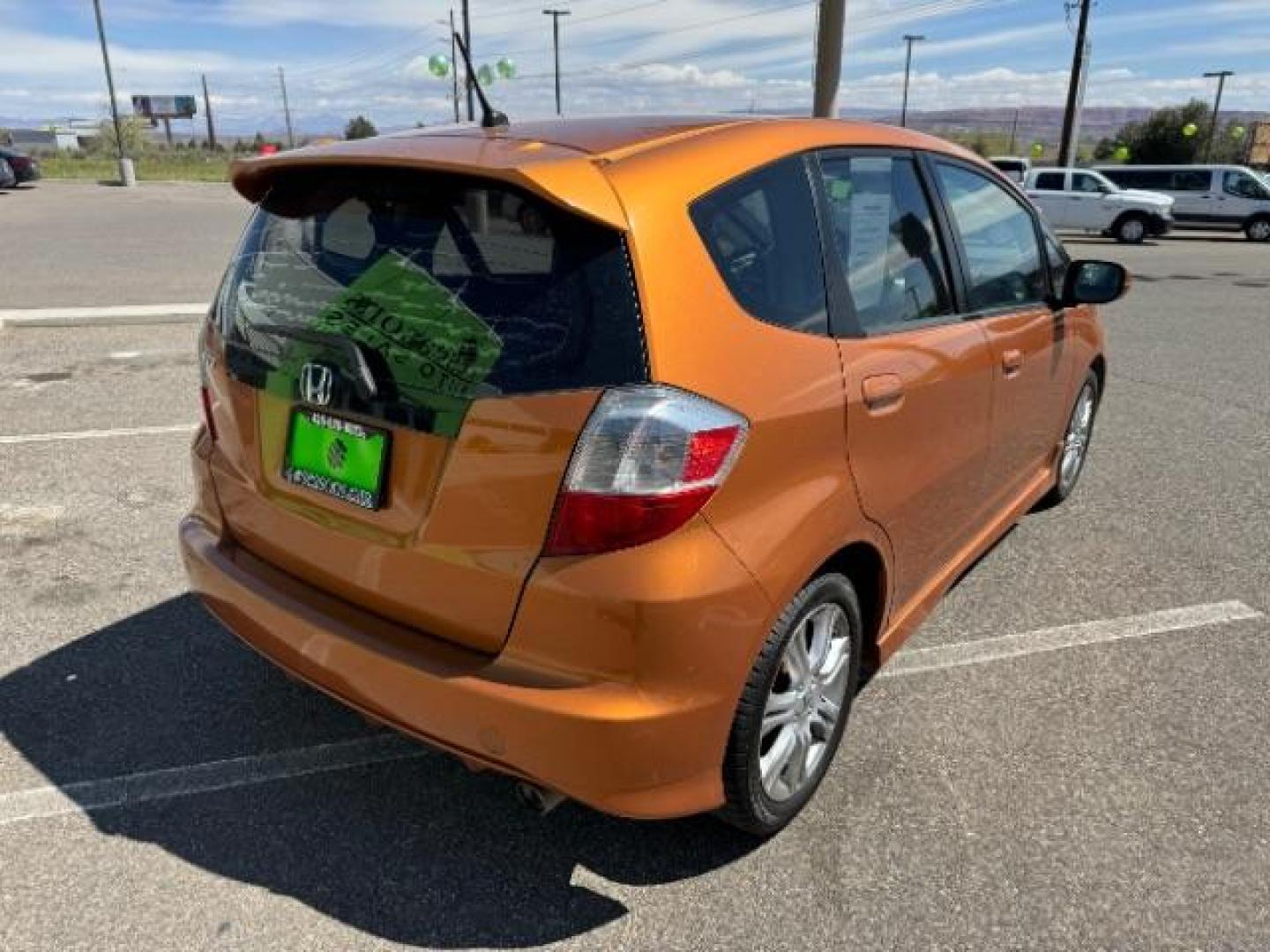 2009 Orange Revolution Me /Black Cloth Interior Honda Fit Sport 5-Speed AT (JHMGE88409S) with an 1.5L L4 SOHC 16V engine, 5-Speed Automatic transmission, located at 1865 East Red Hills Pkwy, St. George, 84770, (435) 628-0023, 37.120850, -113.543640 - We specialize in helping ALL people get the best financing available. No matter your credit score, good, bad or none we can get you an amazing rate. Had a bankruptcy, divorce, or repossessions? We give you the green light to get your credit back on the road. Low down and affordable payments that fit - Photo#9