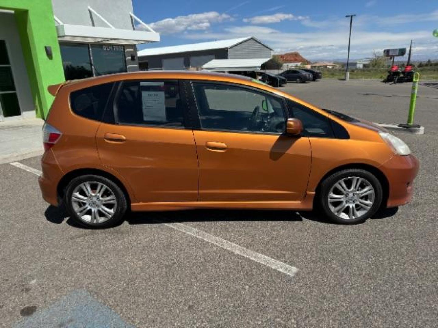 2009 Orange Revolution Me /Black Cloth Interior Honda Fit Sport 5-Speed AT (JHMGE88409S) with an 1.5L L4 SOHC 16V engine, 5-Speed Automatic transmission, located at 1865 East Red Hills Pkwy, St. George, 84770, (435) 628-0023, 37.120850, -113.543640 - We specialize in helping ALL people get the best financing available. No matter your credit score, good, bad or none we can get you an amazing rate. Had a bankruptcy, divorce, or repossessions? We give you the green light to get your credit back on the road. Low down and affordable payments that fit - Photo#10