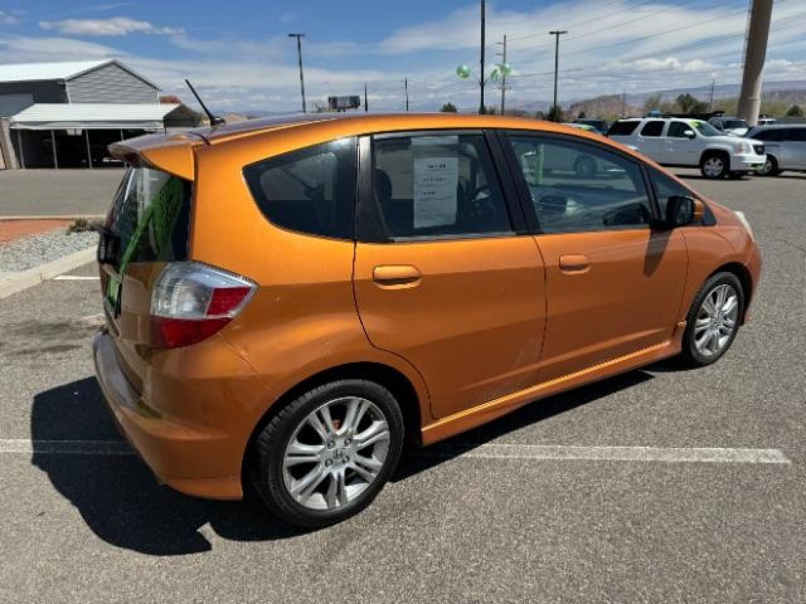 2009 Orange Revolution Metallic /Black Cloth Interior Honda Fit Sport 5-Speed AT (JHMGE88409S) with an 1.5L L4 SOHC 16V engine, 5-Speed Automatic transmission, located at 1865 East Red Hills Pkwy, St. George, 84770, (435) 628-0023, 37.120850, -113.543640 - We specialize in helping ALL people get the best financing available. No matter your credit score, good, bad or none we can get you an amazing rate. Had a bankruptcy, divorce, or repossessions? We give you the green light to get your credit back on the road. Low down and affordable payments that fit - Photo #11