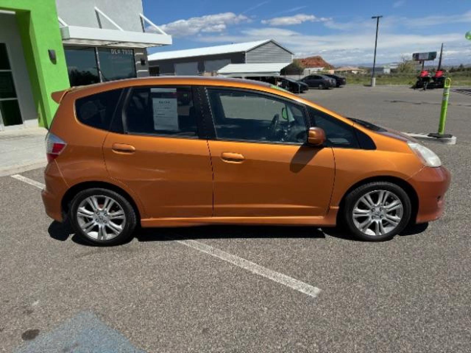 2009 Orange Revolution Metallic /Black Cloth Interior Honda Fit Sport 5-Speed AT (JHMGE88409S) with an 1.5L L4 SOHC 16V engine, 5-Speed Automatic transmission, located at 1865 East Red Hills Pkwy, St. George, 84770, (435) 628-0023, 37.120850, -113.543640 - We specialize in helping ALL people get the best financing available. No matter your credit score, good, bad or none we can get you an amazing rate. Had a bankruptcy, divorce, or repossessions? We give you the green light to get your credit back on the road. Low down and affordable payments that fit - Photo #12