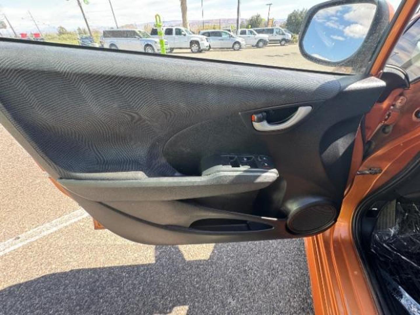 2009 Orange Revolution Me /Black Cloth Interior Honda Fit Sport 5-Speed AT (JHMGE88409S) with an 1.5L L4 SOHC 16V engine, 5-Speed Automatic transmission, located at 1865 East Red Hills Pkwy, St. George, 84770, (435) 628-0023, 37.120850, -113.543640 - We specialize in helping ALL people get the best financing available. No matter your credit score, good, bad or none we can get you an amazing rate. Had a bankruptcy, divorce, or repossessions? We give you the green light to get your credit back on the road. Low down and affordable payments that fit - Photo#16