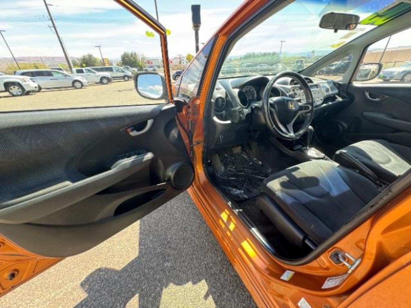 2009 Orange Revolution Metallic /Black Cloth Interior Honda Fit Sport 5-Speed AT (JHMGE88409S) with an 1.5L L4 SOHC 16V engine, 5-Speed Automatic transmission, located at 1865 East Red Hills Pkwy, St. George, 84770, (435) 628-0023, 37.120850, -113.543640 - We specialize in helping ALL people get the best financing available. No matter your credit score, good, bad or none we can get you an amazing rate. Had a bankruptcy, divorce, or repossessions? We give you the green light to get your credit back on the road. Low down and affordable payments that fit - Photo #17