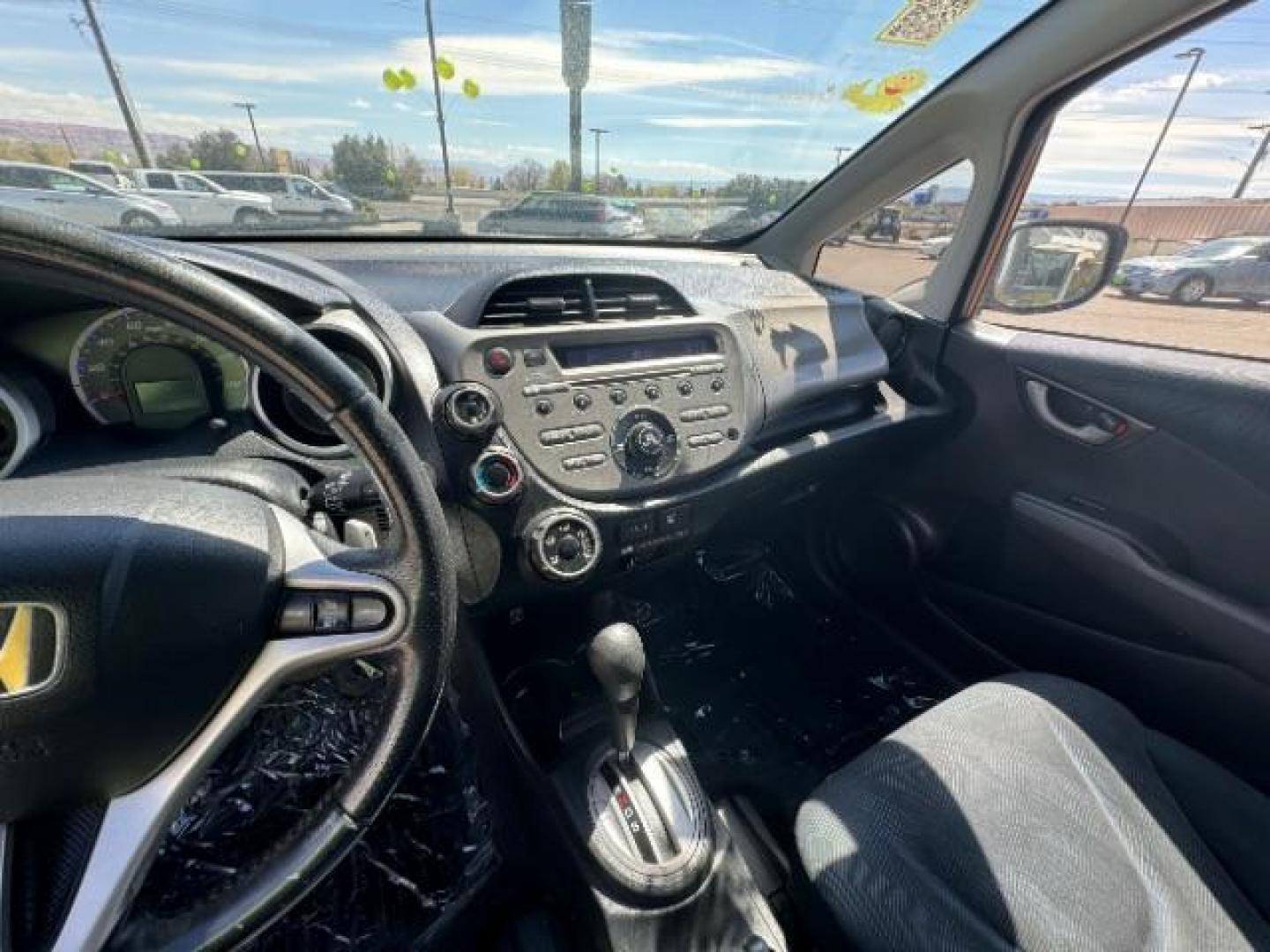 2009 Orange Revolution Me /Black Cloth Interior Honda Fit Sport 5-Speed AT (JHMGE88409S) with an 1.5L L4 SOHC 16V engine, 5-Speed Automatic transmission, located at 1865 East Red Hills Pkwy, St. George, 84770, (435) 628-0023, 37.120850, -113.543640 - We specialize in helping ALL people get the best financing available. No matter your credit score, good, bad or none we can get you an amazing rate. Had a bankruptcy, divorce, or repossessions? We give you the green light to get your credit back on the road. Low down and affordable payments that fit - Photo#18
