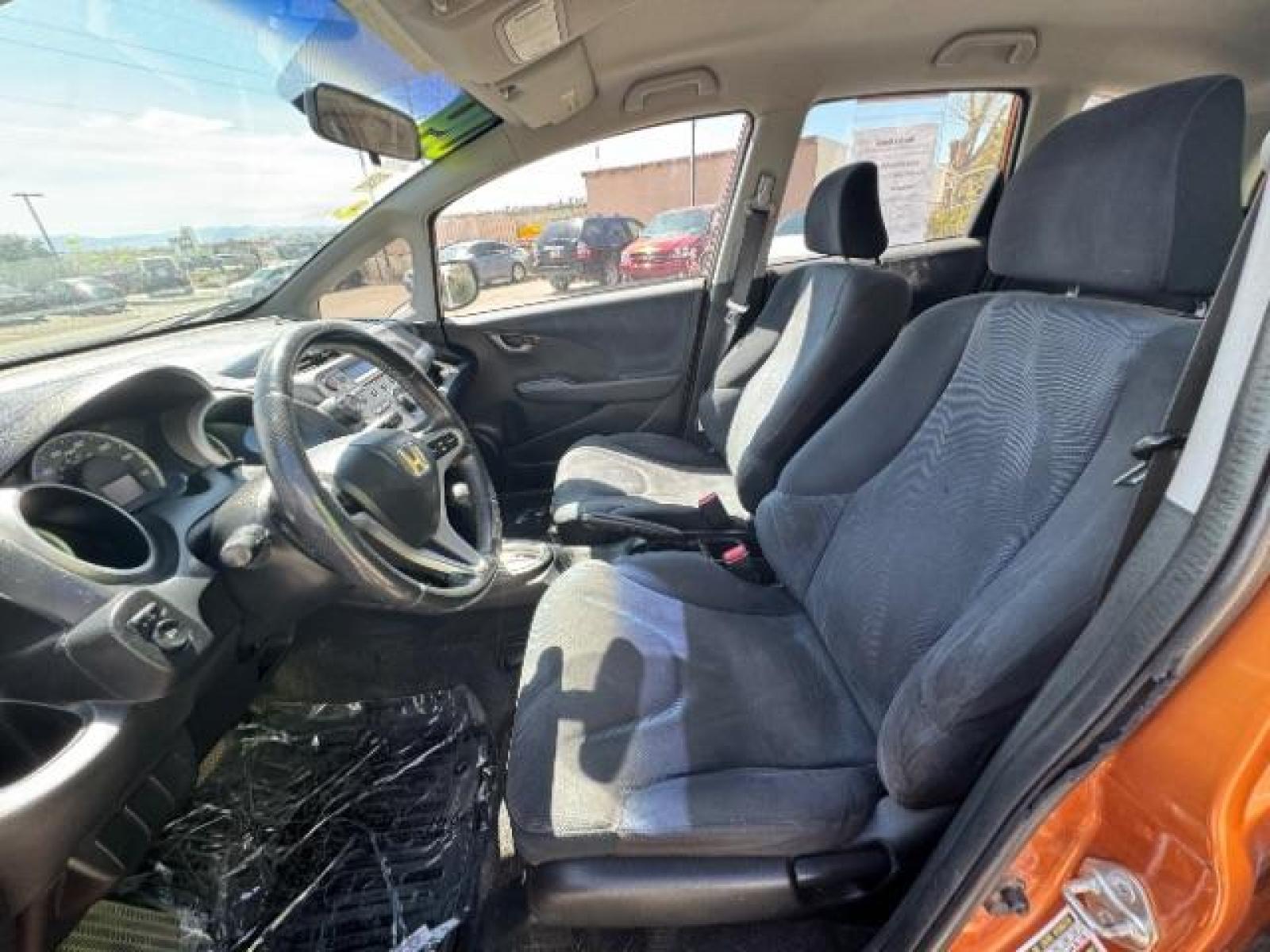 2009 Orange Revolution Metallic /Black Cloth Interior Honda Fit Sport 5-Speed AT (JHMGE88409S) with an 1.5L L4 SOHC 16V engine, 5-Speed Automatic transmission, located at 1865 East Red Hills Pkwy, St. George, 84770, (435) 628-0023, 37.120850, -113.543640 - We specialize in helping ALL people get the best financing available. No matter your credit score, good, bad or none we can get you an amazing rate. Had a bankruptcy, divorce, or repossessions? We give you the green light to get your credit back on the road. Low down and affordable payments that fit - Photo #19