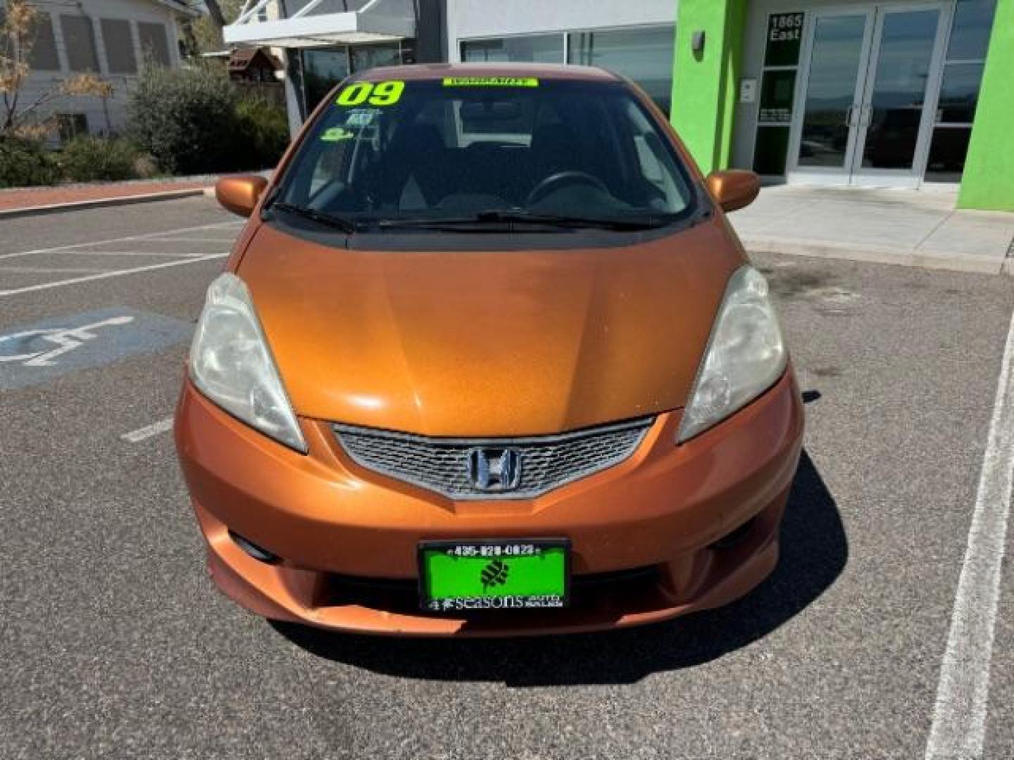 2009 Orange Revolution Me /Black Cloth Interior Honda Fit Sport 5-Speed AT (JHMGE88409S) with an 1.5L L4 SOHC 16V engine, 5-Speed Automatic transmission, located at 1865 East Red Hills Pkwy, St. George, 84770, (435) 628-0023, 37.120850, -113.543640 - We specialize in helping ALL people get the best financing available. No matter your credit score, good, bad or none we can get you an amazing rate. Had a bankruptcy, divorce, or repossessions? We give you the green light to get your credit back on the road. Low down and affordable payments that fit - Photo#2