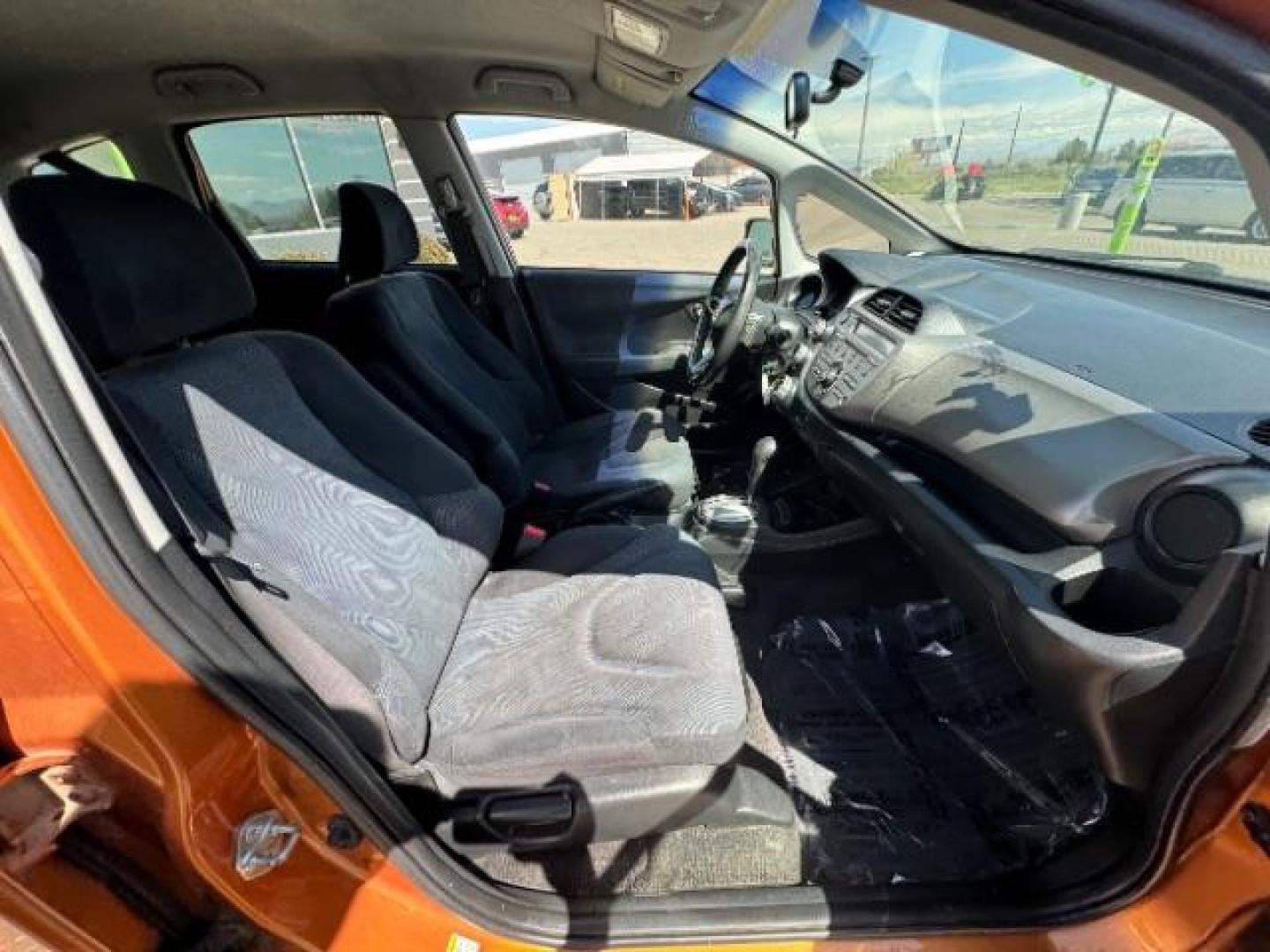 2009 Orange Revolution Me /Black Cloth Interior Honda Fit Sport 5-Speed AT (JHMGE88409S) with an 1.5L L4 SOHC 16V engine, 5-Speed Automatic transmission, located at 1865 East Red Hills Pkwy, St. George, 84770, (435) 628-0023, 37.120850, -113.543640 - We specialize in helping ALL people get the best financing available. No matter your credit score, good, bad or none we can get you an amazing rate. Had a bankruptcy, divorce, or repossessions? We give you the green light to get your credit back on the road. Low down and affordable payments that fit - Photo#29