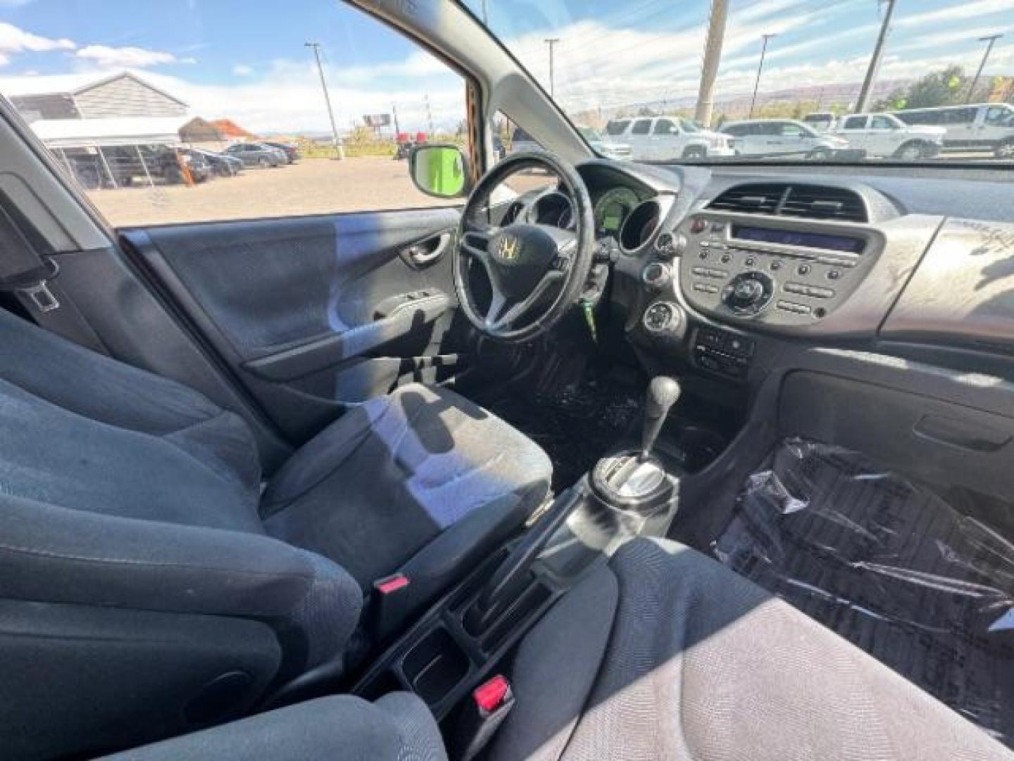 2009 Orange Revolution Me /Black Cloth Interior Honda Fit Sport 5-Speed AT (JHMGE88409S) with an 1.5L L4 SOHC 16V engine, 5-Speed Automatic transmission, located at 1865 East Red Hills Pkwy, St. George, 84770, (435) 628-0023, 37.120850, -113.543640 - We specialize in helping ALL people get the best financing available. No matter your credit score, good, bad or none we can get you an amazing rate. Had a bankruptcy, divorce, or repossessions? We give you the green light to get your credit back on the road. Low down and affordable payments that fit - Photo#30