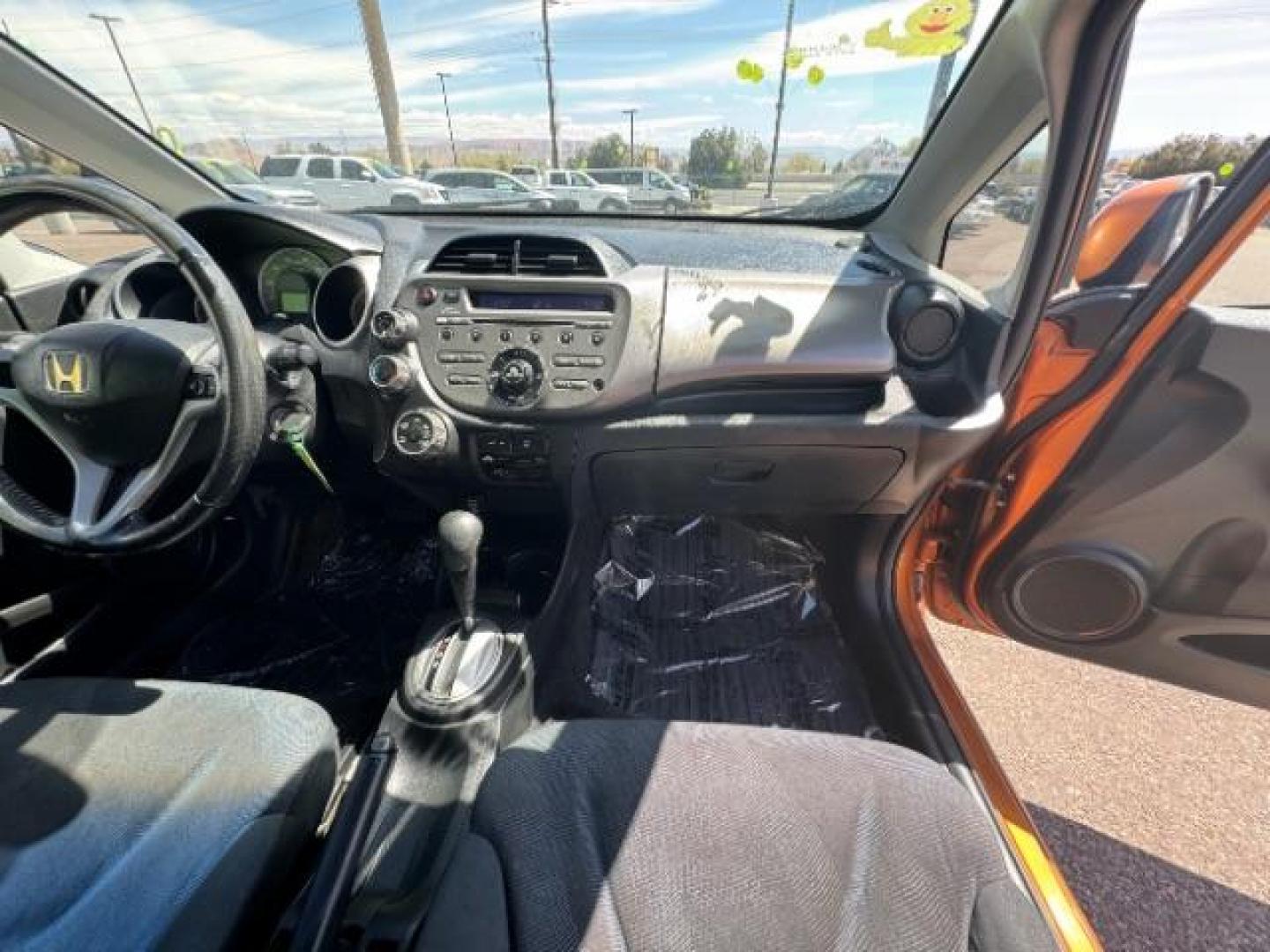2009 Orange Revolution Me /Black Cloth Interior Honda Fit Sport 5-Speed AT (JHMGE88409S) with an 1.5L L4 SOHC 16V engine, 5-Speed Automatic transmission, located at 1865 East Red Hills Pkwy, St. George, 84770, (435) 628-0023, 37.120850, -113.543640 - We specialize in helping ALL people get the best financing available. No matter your credit score, good, bad or none we can get you an amazing rate. Had a bankruptcy, divorce, or repossessions? We give you the green light to get your credit back on the road. Low down and affordable payments that fit - Photo#31