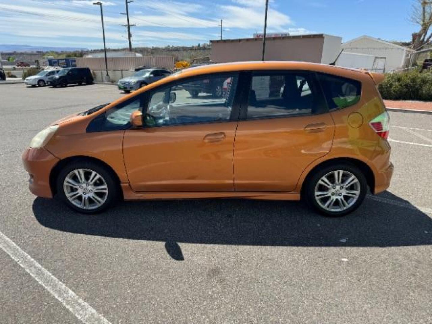 2009 Orange Revolution Me /Black Cloth Interior Honda Fit Sport 5-Speed AT (JHMGE88409S) with an 1.5L L4 SOHC 16V engine, 5-Speed Automatic transmission, located at 1865 East Red Hills Pkwy, St. George, 84770, (435) 628-0023, 37.120850, -113.543640 - We specialize in helping ALL people get the best financing available. No matter your credit score, good, bad or none we can get you an amazing rate. Had a bankruptcy, divorce, or repossessions? We give you the green light to get your credit back on the road. Low down and affordable payments that fit - Photo#5