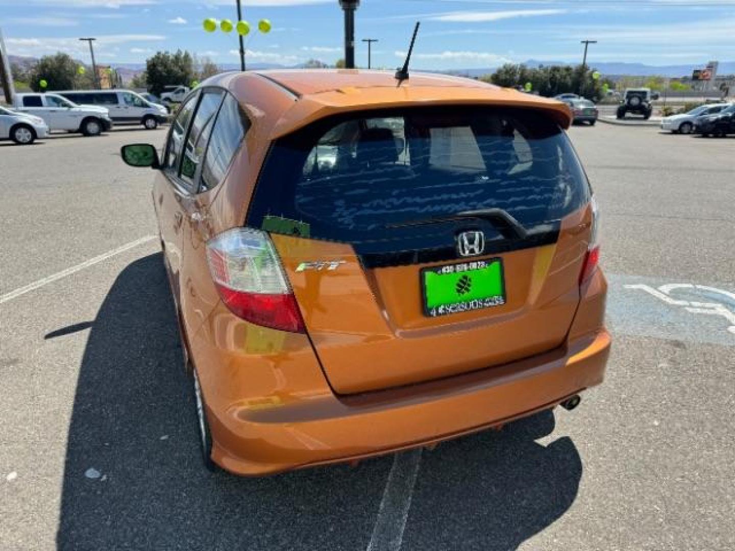 2009 Orange Revolution Me /Black Cloth Interior Honda Fit Sport 5-Speed AT (JHMGE88409S) with an 1.5L L4 SOHC 16V engine, 5-Speed Automatic transmission, located at 1865 East Red Hills Pkwy, St. George, 84770, (435) 628-0023, 37.120850, -113.543640 - We specialize in helping ALL people get the best financing available. No matter your credit score, good, bad or none we can get you an amazing rate. Had a bankruptcy, divorce, or repossessions? We give you the green light to get your credit back on the road. Low down and affordable payments that fit - Photo#6
