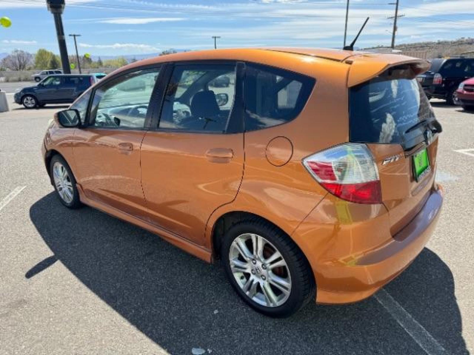 2009 Orange Revolution Metallic /Black Cloth Interior Honda Fit Sport 5-Speed AT (JHMGE88409S) with an 1.5L L4 SOHC 16V engine, 5-Speed Automatic transmission, located at 1865 East Red Hills Pkwy, St. George, 84770, (435) 628-0023, 37.120850, -113.543640 - We specialize in helping ALL people get the best financing available. No matter your credit score, good, bad or none we can get you an amazing rate. Had a bankruptcy, divorce, or repossessions? We give you the green light to get your credit back on the road. Low down and affordable payments that fit - Photo #7