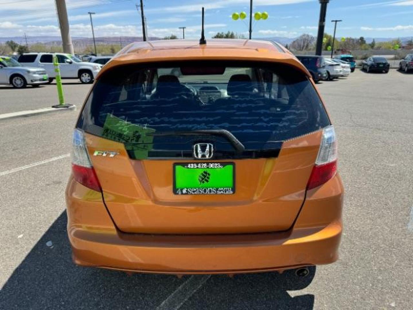 2009 Orange Revolution Me /Black Cloth Interior Honda Fit Sport 5-Speed AT (JHMGE88409S) with an 1.5L L4 SOHC 16V engine, 5-Speed Automatic transmission, located at 1865 East Red Hills Pkwy, St. George, 84770, (435) 628-0023, 37.120850, -113.543640 - We specialize in helping ALL people get the best financing available. No matter your credit score, good, bad or none we can get you an amazing rate. Had a bankruptcy, divorce, or repossessions? We give you the green light to get your credit back on the road. Low down and affordable payments that fit - Photo#8
