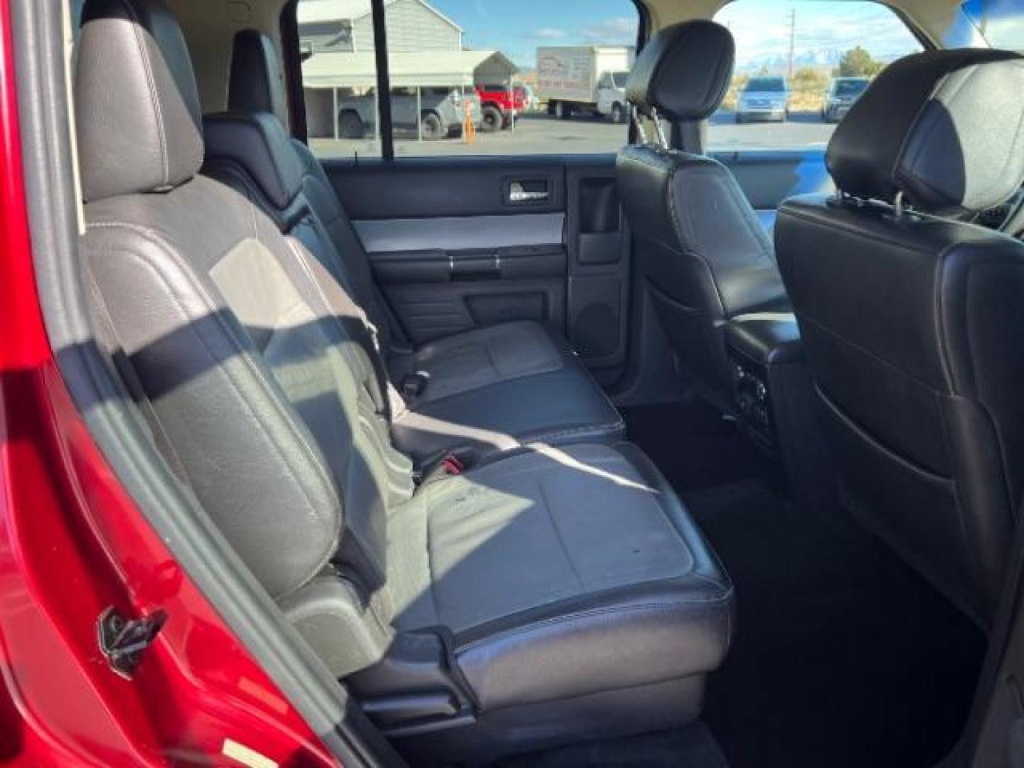 2014 Ruby Red Met Tinted CC /Charcoal Black Ford Flex SEL FWD (2FMGK5C84EB) with an 3.5L V6 DOHC 24V engine, 6-Speed Automatic Overdrive transmission, located at 940 North Main Street, Cedar City, UT, 84720, (435) 628-0023, 37.692936, -113.061897 - We specialize in helping ALL people get the best financing available. No matter your credit score, good, bad or none we can get you an amazing rate. Had a bankruptcy, divorce, or repossessions? We give you the green light to get your credit back on the road. Low down and affordable payments that fit - Photo#30