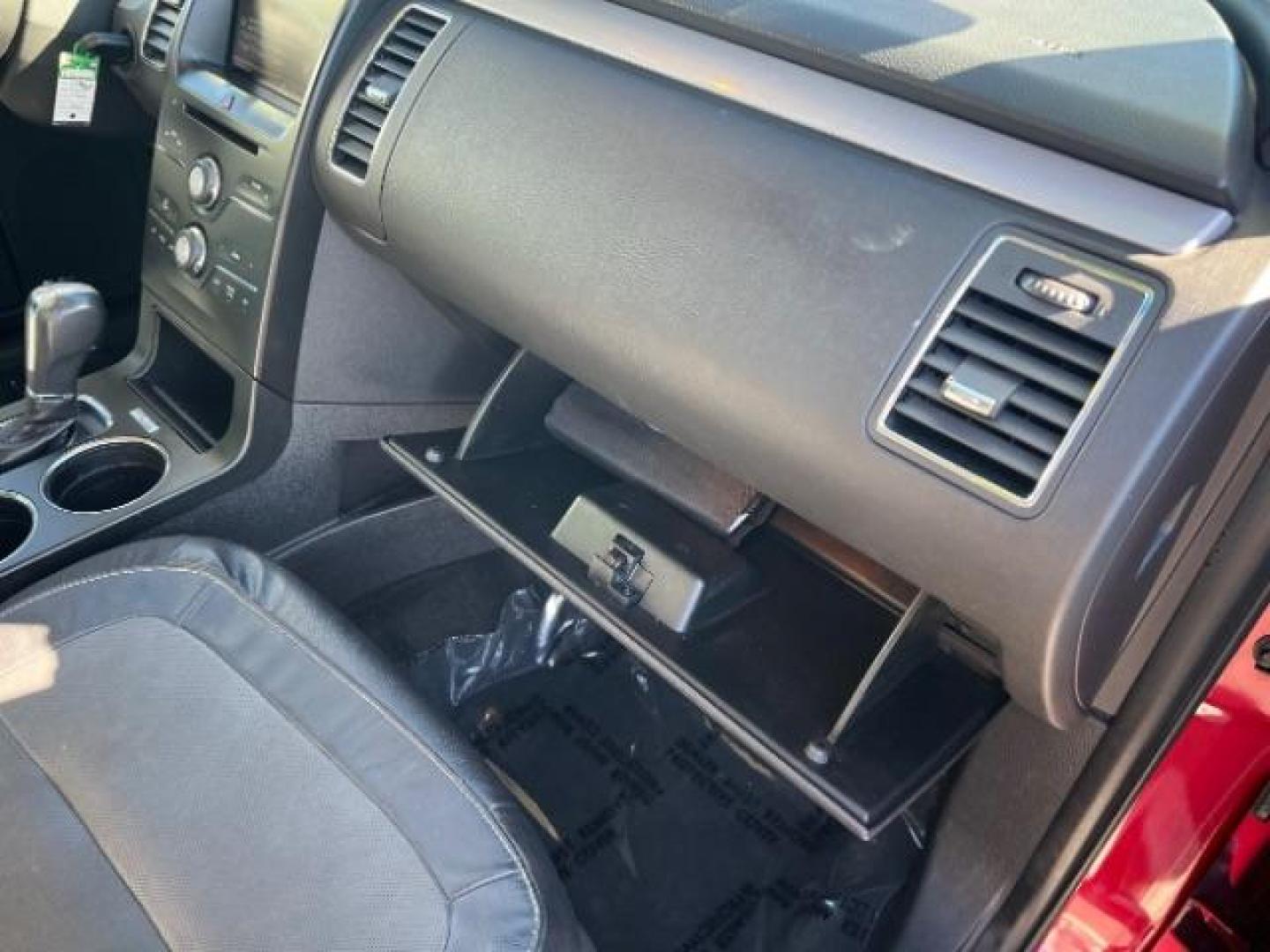 2014 Ruby Red Met Tinted CC /Charcoal Black Ford Flex SEL FWD (2FMGK5C84EB) with an 3.5L V6 DOHC 24V engine, 6-Speed Automatic Overdrive transmission, located at 940 North Main Street, Cedar City, UT, 84720, (435) 628-0023, 37.692936, -113.061897 - We specialize in helping ALL people get the best financing available. No matter your credit score, good, bad or none we can get you an amazing rate. Had a bankruptcy, divorce, or repossessions? We give you the green light to get your credit back on the road. Low down and affordable payments that fit - Photo#33