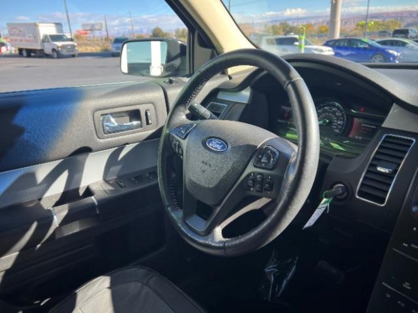 2014 Ruby Red Met Tinted CC /Charcoal Black Ford Flex SEL FWD (2FMGK5C84EB) with an 3.5L V6 DOHC 24V engine, 6-Speed Automatic Overdrive transmission, located at 940 North Main Street, Cedar City, UT, 84720, (435) 628-0023, 37.692936, -113.061897 - We specialize in helping ALL people get the best financing available. No matter your credit score, good, bad or none we can get you an amazing rate. Had a bankruptcy, divorce, or repossessions? We give you the green light to get your credit back on the road. Low down and affordable payments that fit - Photo#34