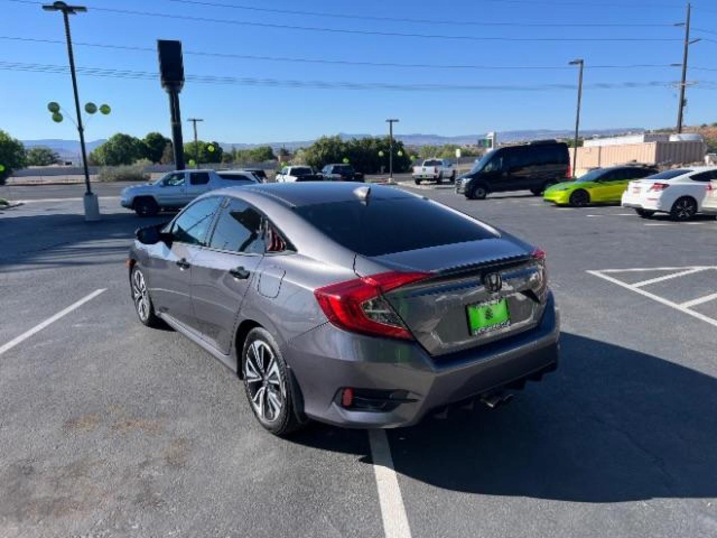 2016 Modern Steel Metallic /Black, cloth Honda Civic EX-T Sedan CVT (19XFC1F38GE) with an 1.5L L4 DOHC 16V TURBO engine, Continuously Variable Transmission transmission, located at 1865 East Red Hills Pkwy, St. George, 84770, (435) 628-0023, 37.120850, -113.543640 - We specialize in helping ALL people get the best financing available. No matter your credit score, good, bad or none we can get you an amazing rate. Had a bankruptcy, divorce, or repossessions? We give you the green light to get your credit back on the road. Low down and affordable payments that fit - Photo#4