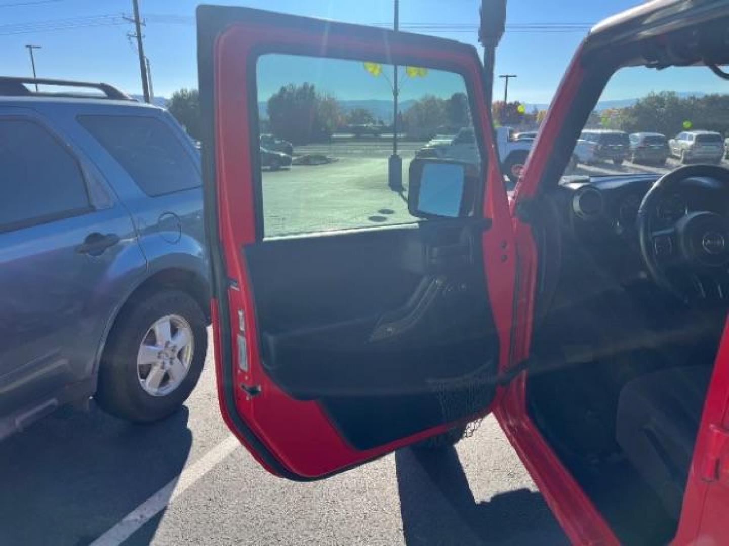 2017 Firecracker Red Clear Coat /Black, cloth Jeep Wrangler Unlimited Sport 4WD (1C4BJWDG2HL) with an 3.6L V6 DOHC 24V FFV engine, 5-Speed Automatic transmission, located at 1865 East Red Hills Pkwy, St. George, 84770, (435) 628-0023, 37.120850, -113.543640 - We specialize in helping ALL people get the best financing available. No matter your credit score, good, bad or none we can get you an amazing rate. Had a bankruptcy, divorce, or repossessions? We give you the green light to get your credit back on the road. Low down and affordable payments that fit - Photo#12