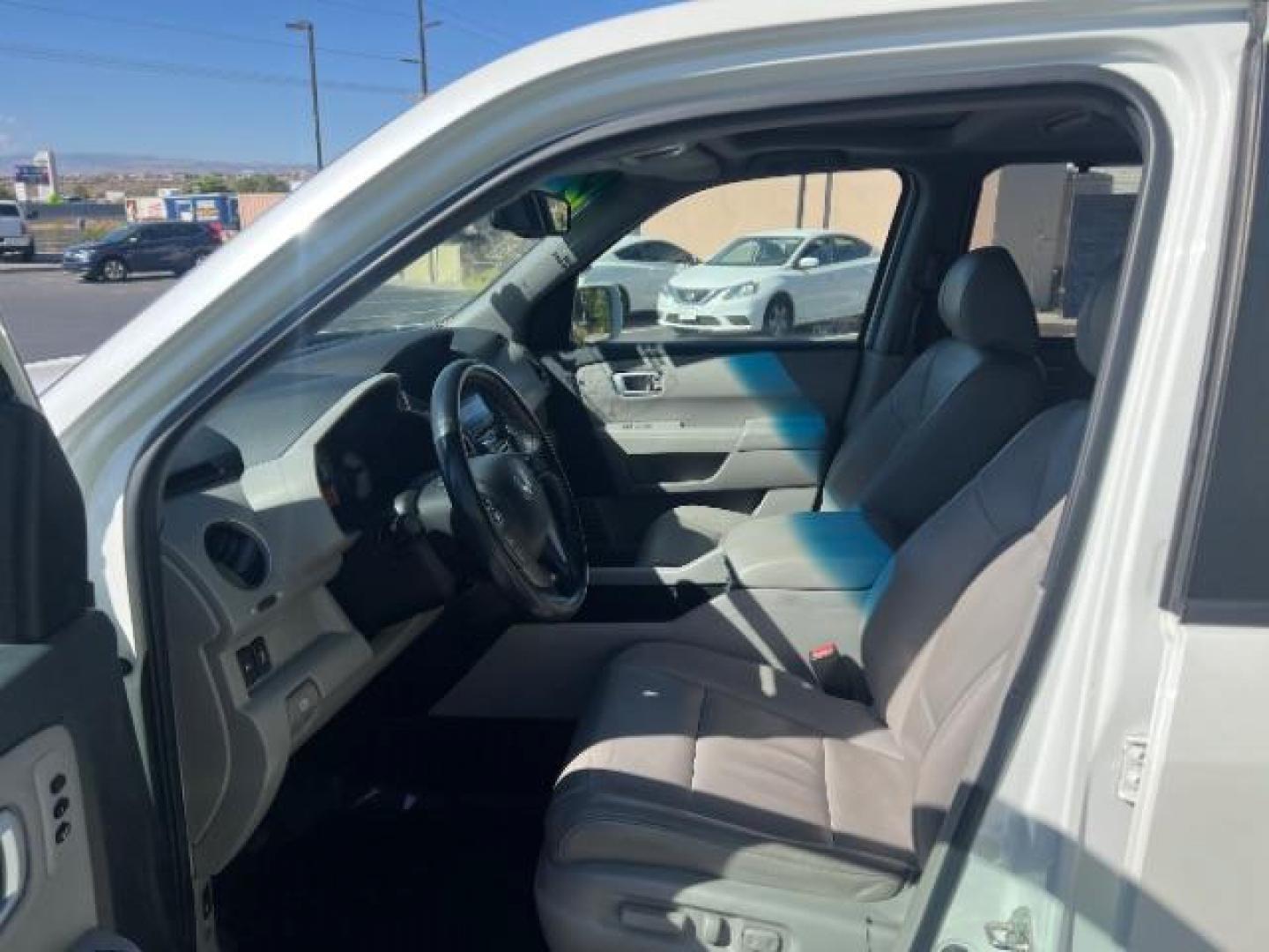 2012 White Diamond Pearl /Gray Leather Interio Honda Pilot Touring 4WD 5-Spd AT (5FNYF4H90CB) with an 3.5L V6 SOHC 24V engine, 5-Speed Automatic transmission, located at 1865 East Red Hills Pkwy, St. George, 84770, (435) 628-0023, 37.120850, -113.543640 - We specialize in helping ALL people get the best financing available. No matter your credit score, good, bad or none we can get you an amazing rate. Had a bankruptcy, divorce, or repossessions? We give you the green light to get your credit back on the road. Low down and affordable payments that fit - Photo#14