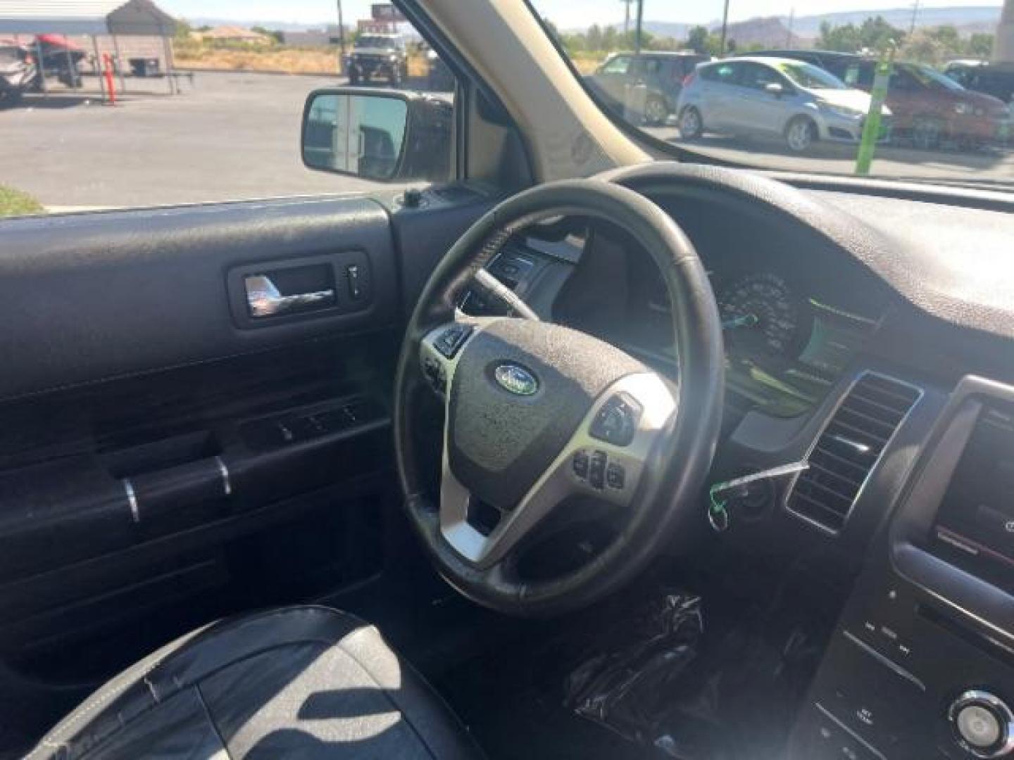 2014 Tuxedo Black Metallic /Charcoal Black Ford Flex SEL FWD (2FMGK5C83EB) with an 3.5L V6 DOHC 24V engine, 6-Speed Automatic Overdrive transmission, located at 1865 East Red Hills Pkwy, St. George, 84770, (435) 628-0023, 37.120850, -113.543640 - We specialize in helping ALL people get the best financing available. No matter your credit score, good, bad or none we can get you an amazing rate. Had a bankruptcy, divorce, or repossessions? We give you the green light to get your credit back on the road. Low down and affordable payments that fit - Photo#32
