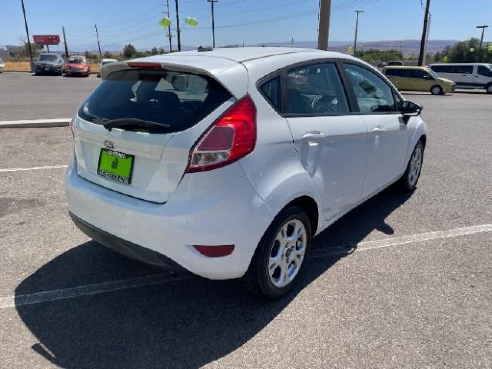 2015 Oxford White /Charcoal Black Ford Fiesta SE Hatchback (3FADP4EJ4FM) with an 1.6L L4 DOHC 16V engine, 6-Speed Automatic transmission, located at 1865 East Red Hills Pkwy, St. George, 84770, (435) 628-0023, 37.120850, -113.543640 - We specialize in helping ALL people get the best financing available. No matter your credit score, good, bad or none we can get you an amazing rate. Had a bankruptcy, divorce, or repossessions? We give you the green light to get your credit back on the road. Low down and affordable payments that fit - Photo #9