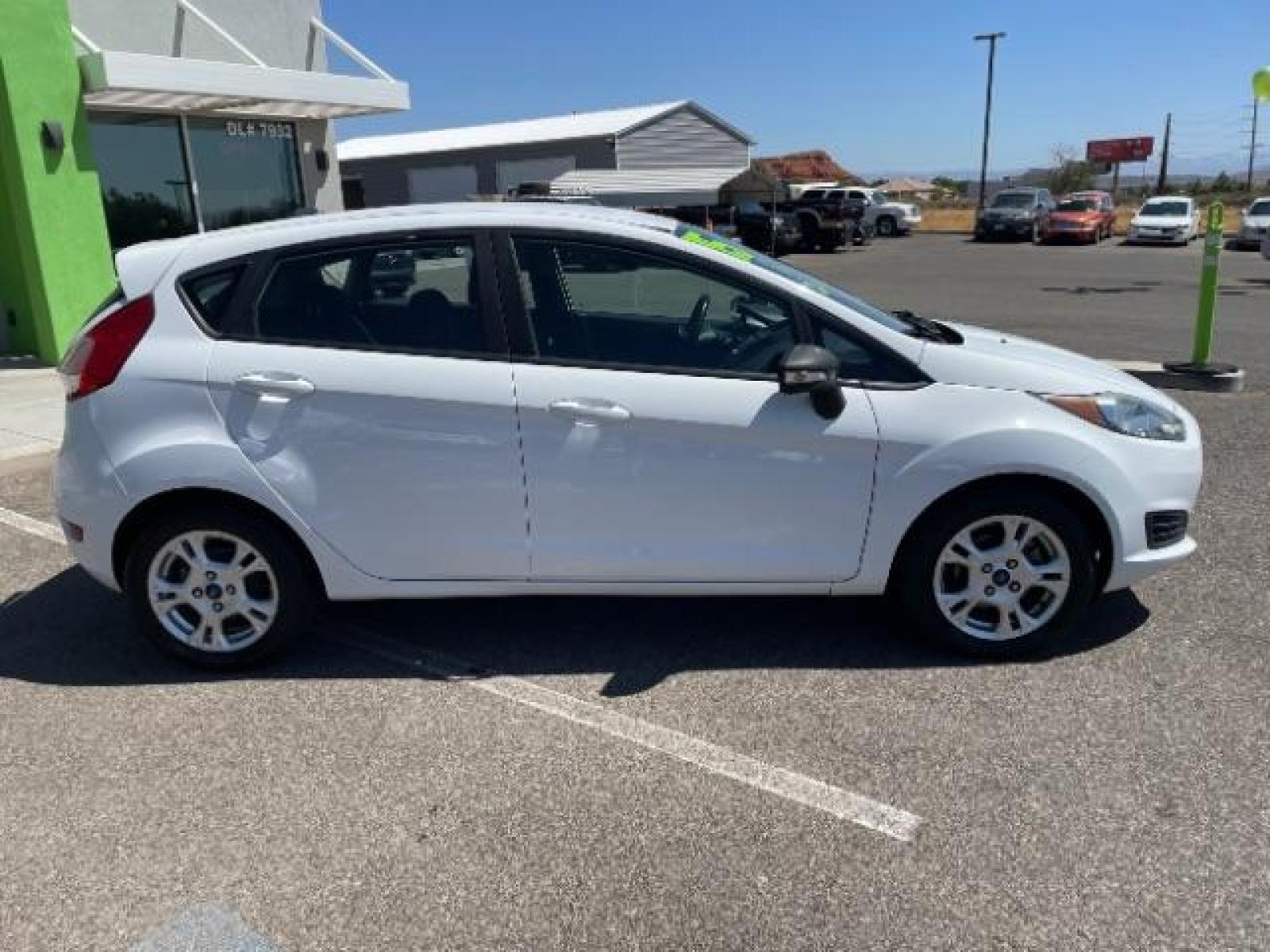 2015 Oxford White /Charcoal Black Ford Fiesta SE Hatchback (3FADP4EJ4FM) with an 1.6L L4 DOHC 16V engine, 6-Speed Automatic transmission, located at 1865 East Red Hills Pkwy, St. George, 84770, (435) 628-0023, 37.120850, -113.543640 - We specialize in helping ALL people get the best financing available. No matter your credit score, good, bad or none we can get you an amazing rate. Had a bankruptcy, divorce, or repossessions? We give you the green light to get your credit back on the road. Low down and affordable payments that fit - Photo #11