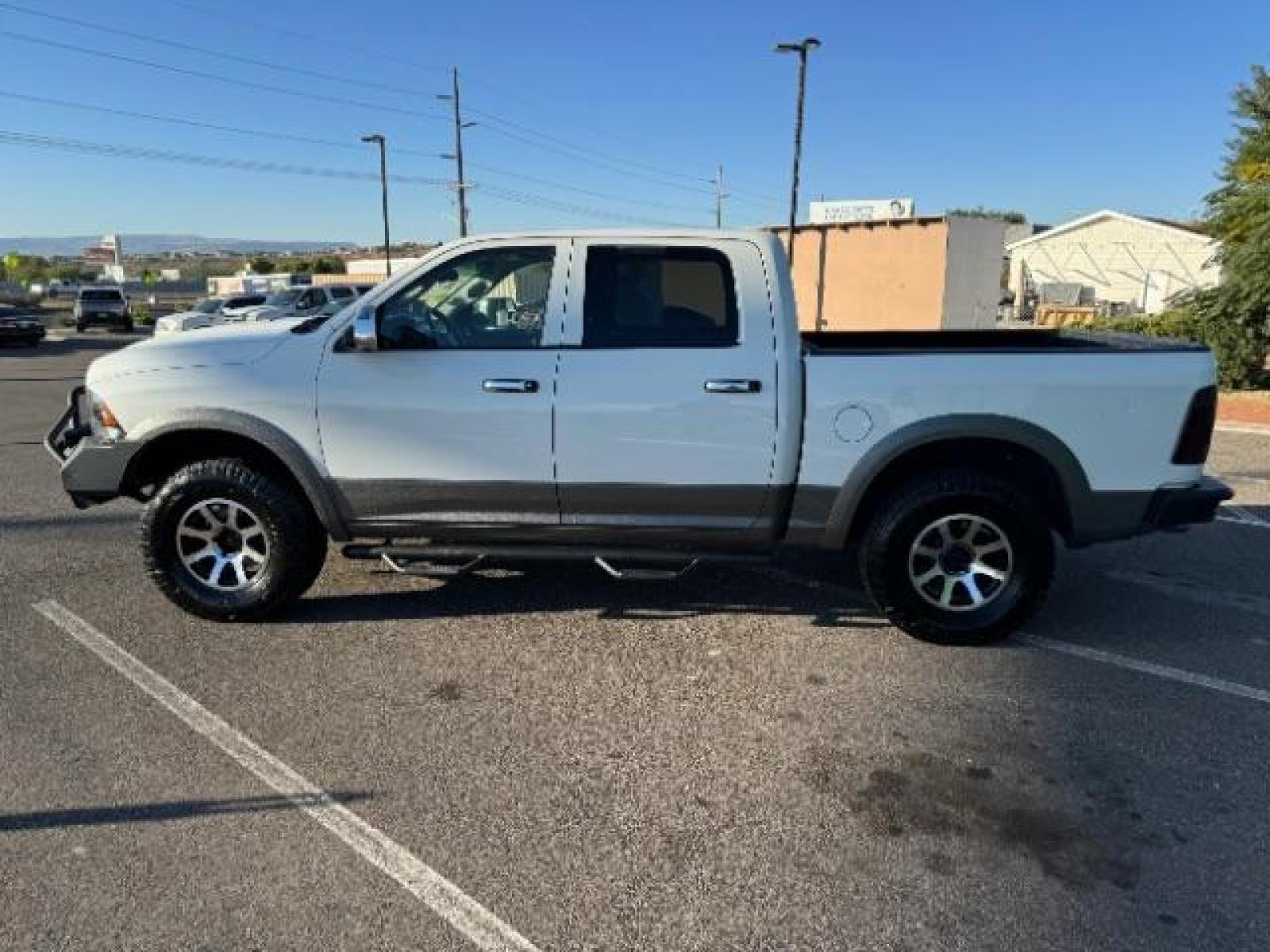 2012 Bright White /Dark Slate Leather Interior RAM 1500 Laramie Crew Cab 4WD (1C6RD7NTXCS) with an 5.7L V8 OHV 16V engine, 6-Speed Automatic transmission, located at 1865 East Red Hills Pkwy, St. George, 84770, (435) 628-0023, 37.120850, -113.543640 - Photo #6