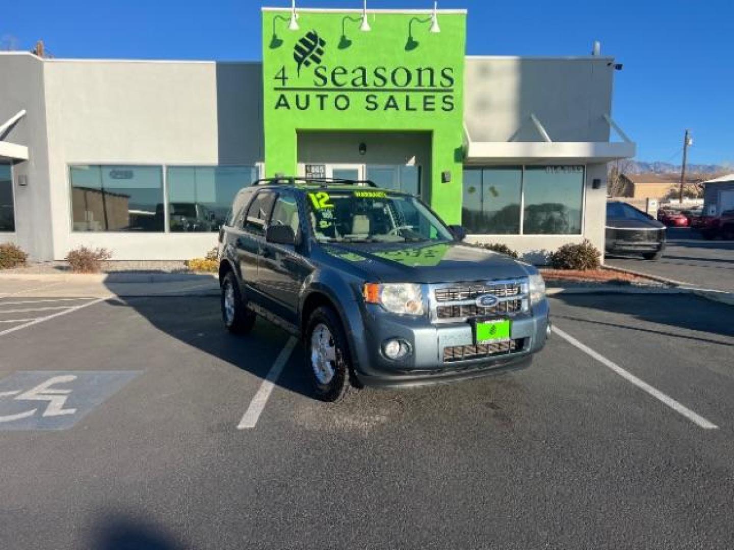 2012 Steel Blue Metallic /Camel Cloth Interior Ford Escape XLT FWD (1FMCU0DG8CK) with an 3.0L V6 DOHC 24V engine, 6-Speed Automatic transmission, located at 940 North Main Street, Cedar City, UT, 84720, (435) 628-0023, 37.692936, -113.061897 - We specialize in helping ALL people get the best financing available. No matter your credit score, good, bad or none we can get you an amazing rate. Had a bankruptcy, divorce, or repossessions? We give you the green light to get your credit back on the road. Low down and affordable payments that fit - Photo#0