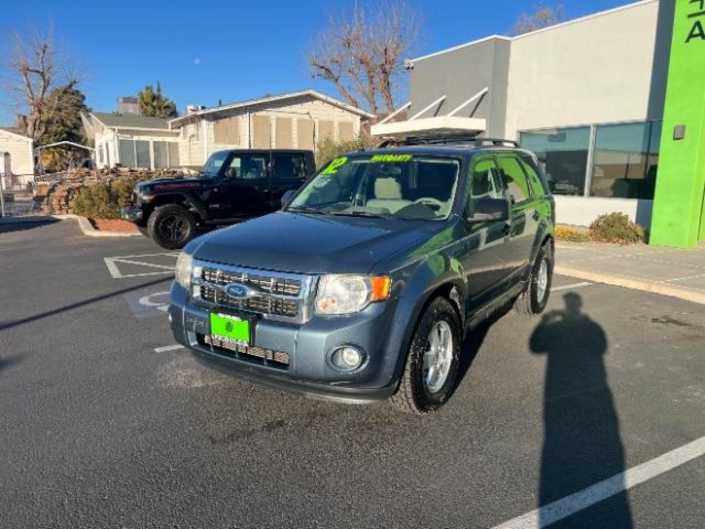 2012 Steel Blue Metallic /Camel Cloth Interior Ford Escape XLT FWD (1FMCU0DG8CK) with an 3.0L V6 DOHC 24V engine, 6-Speed Automatic transmission, located at 940 North Main Street, Cedar City, UT, 84720, (435) 628-0023, 37.692936, -113.061897 - We specialize in helping ALL people get the best financing available. No matter your credit score, good, bad or none we can get you an amazing rate. Had a bankruptcy, divorce, or repossessions? We give you the green light to get your credit back on the road. Low down and affordable payments that fit - Photo#2