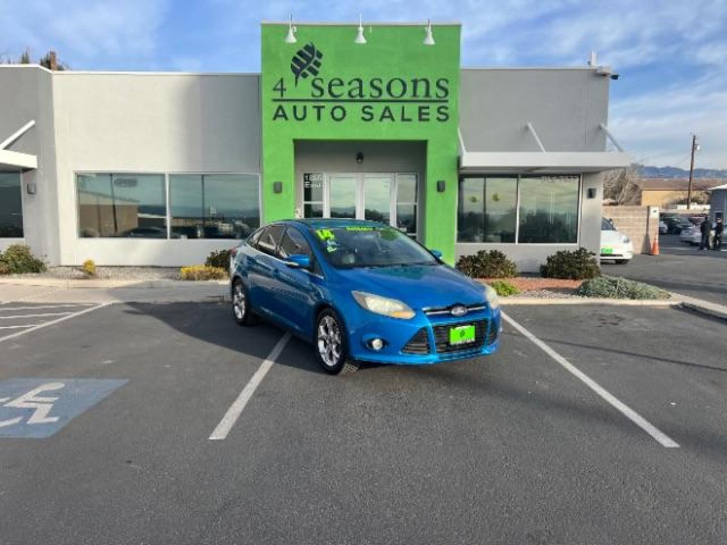 2014 Blue Candy Tinted CC /Charcoal Black Ford Focus Titanium Sedan (1FADP3J2XEL) with an 2.0L L4 DOHC 16V engine, 6-Speed Automatic transmission, located at 1865 East Red Hills Pkwy, St. George, 84770, (435) 628-0023, 37.120850, -113.543640 - We specialize in helping ALL people get the best financing available. No matter your credit score, good, bad or none we can get you an amazing rate. Had a bankruptcy, divorce, or repossessions? We give you the green light to get your credit back on the road. Low down and affordable payments that fit - Photo#0