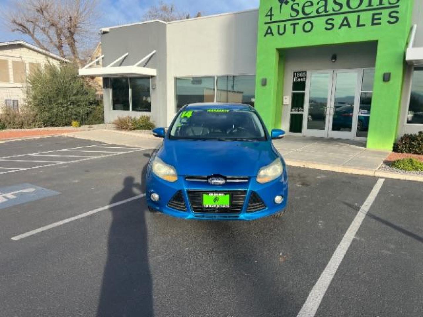 2014 Blue Candy Tinted CC /Charcoal Black Ford Focus Titanium Sedan (1FADP3J2XEL) with an 2.0L L4 DOHC 16V engine, 6-Speed Automatic transmission, located at 1865 East Red Hills Pkwy, St. George, 84770, (435) 628-0023, 37.120850, -113.543640 - We specialize in helping ALL people get the best financing available. No matter your credit score, good, bad or none we can get you an amazing rate. Had a bankruptcy, divorce, or repossessions? We give you the green light to get your credit back on the road. Low down and affordable payments that fit - Photo#1