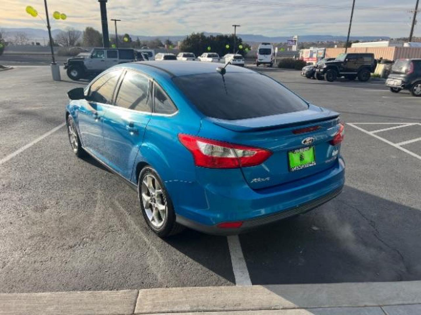 2014 Blue Candy Tinted CC /Charcoal Black Ford Focus Titanium Sedan (1FADP3J2XEL) with an 2.0L L4 DOHC 16V engine, 6-Speed Automatic transmission, located at 1865 East Red Hills Pkwy, St. George, 84770, (435) 628-0023, 37.120850, -113.543640 - We specialize in helping ALL people get the best financing available. No matter your credit score, good, bad or none we can get you an amazing rate. Had a bankruptcy, divorce, or repossessions? We give you the green light to get your credit back on the road. Low down and affordable payments that fit - Photo#4