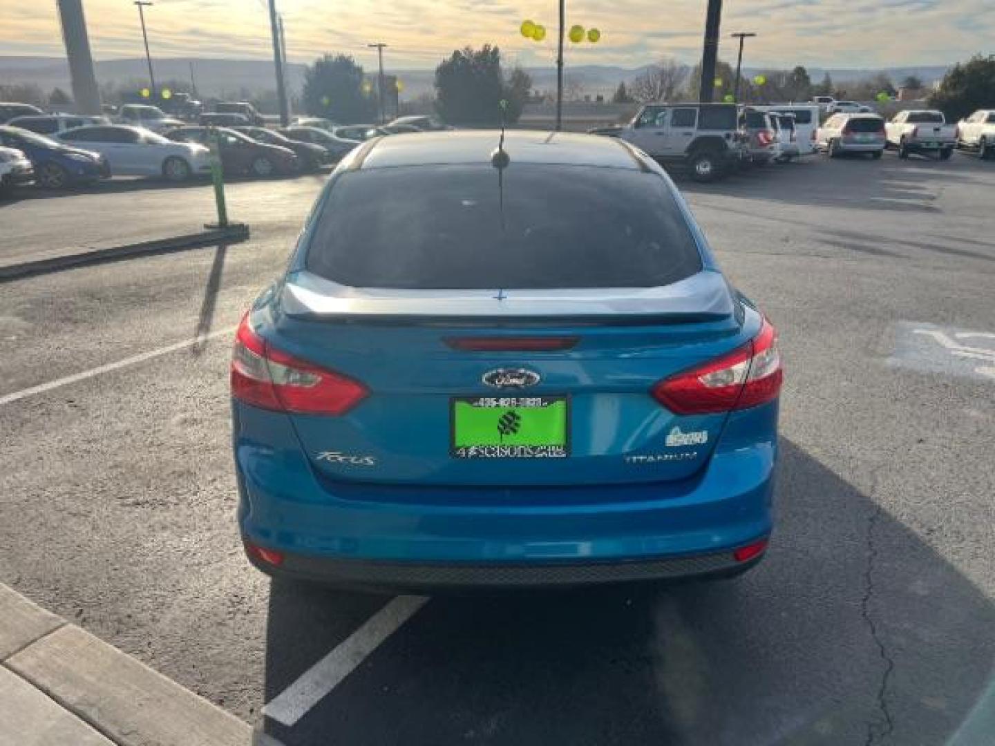 2014 Blue Candy Tinted CC /Charcoal Black Ford Focus Titanium Sedan (1FADP3J2XEL) with an 2.0L L4 DOHC 16V engine, 6-Speed Automatic transmission, located at 1865 East Red Hills Pkwy, St. George, 84770, (435) 628-0023, 37.120850, -113.543640 - We specialize in helping ALL people get the best financing available. No matter your credit score, good, bad or none we can get you an amazing rate. Had a bankruptcy, divorce, or repossessions? We give you the green light to get your credit back on the road. Low down and affordable payments that fit - Photo#5