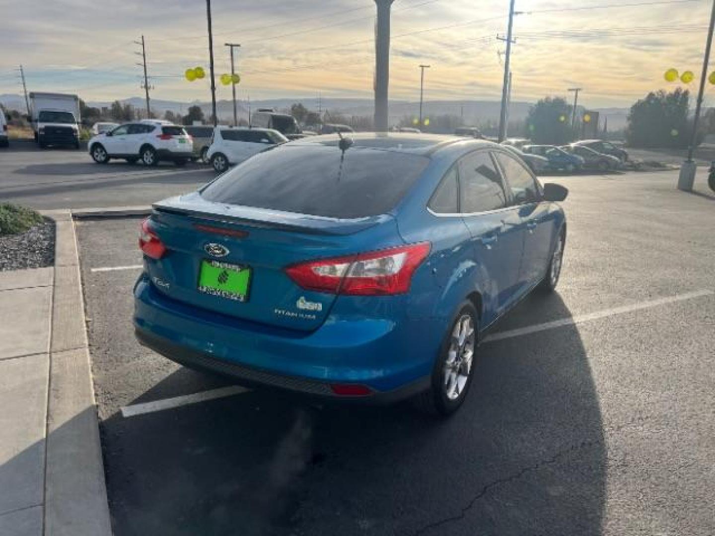 2014 Blue Candy Tinted CC /Charcoal Black Ford Focus Titanium Sedan (1FADP3J2XEL) with an 2.0L L4 DOHC 16V engine, 6-Speed Automatic transmission, located at 1865 East Red Hills Pkwy, St. George, 84770, (435) 628-0023, 37.120850, -113.543640 - We specialize in helping ALL people get the best financing available. No matter your credit score, good, bad or none we can get you an amazing rate. Had a bankruptcy, divorce, or repossessions? We give you the green light to get your credit back on the road. Low down and affordable payments that fit - Photo#6