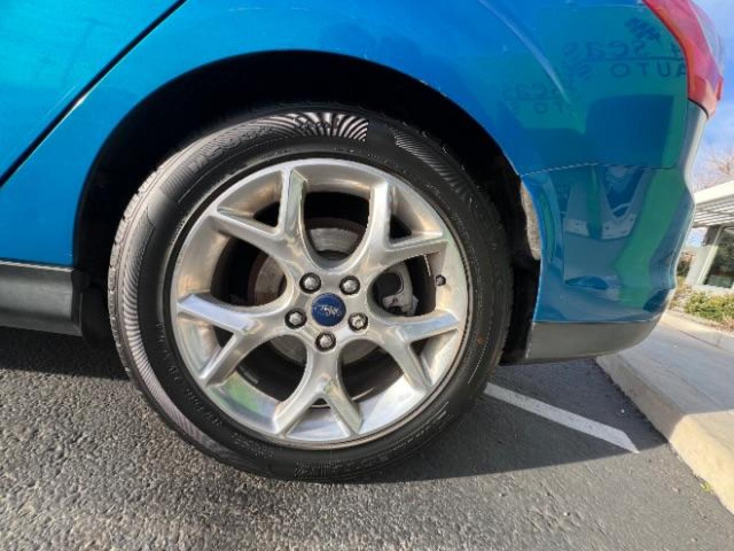 2014 Blue Candy Tinted CC /Charcoal Black Ford Focus Titanium Sedan (1FADP3J2XEL) with an 2.0L L4 DOHC 16V engine, 6-Speed Automatic transmission, located at 1865 East Red Hills Pkwy, St. George, 84770, (435) 628-0023, 37.120850, -113.543640 - We specialize in helping ALL people get the best financing available. No matter your credit score, good, bad or none we can get you an amazing rate. Had a bankruptcy, divorce, or repossessions? We give you the green light to get your credit back on the road. Low down and affordable payments that fit - Photo#11