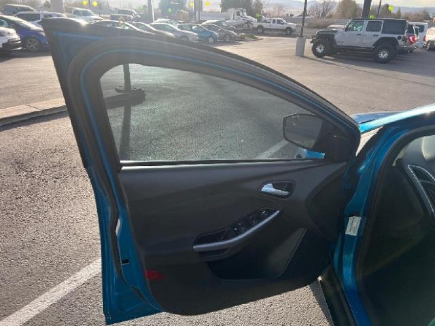 2014 Blue Candy Tinted CC /Charcoal Black Ford Focus Titanium Sedan (1FADP3J2XEL) with an 2.0L L4 DOHC 16V engine, 6-Speed Automatic transmission, located at 1865 East Red Hills Pkwy, St. George, 84770, (435) 628-0023, 37.120850, -113.543640 - We specialize in helping ALL people get the best financing available. No matter your credit score, good, bad or none we can get you an amazing rate. Had a bankruptcy, divorce, or repossessions? We give you the green light to get your credit back on the road. Low down and affordable payments that fit - Photo#12
