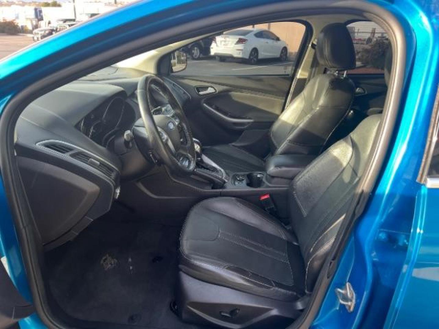 2014 Blue Candy Tinted CC /Charcoal Black Ford Focus Titanium Sedan (1FADP3J2XEL) with an 2.0L L4 DOHC 16V engine, 6-Speed Automatic transmission, located at 1865 East Red Hills Pkwy, St. George, 84770, (435) 628-0023, 37.120850, -113.543640 - We specialize in helping ALL people get the best financing available. No matter your credit score, good, bad or none we can get you an amazing rate. Had a bankruptcy, divorce, or repossessions? We give you the green light to get your credit back on the road. Low down and affordable payments that fit - Photo#14