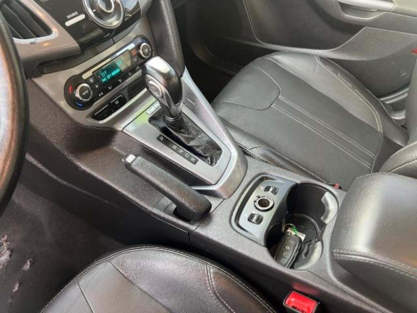 2014 Blue Candy Tinted CC /Charcoal Black Ford Focus Titanium Sedan (1FADP3J2XEL) with an 2.0L L4 DOHC 16V engine, 6-Speed Automatic transmission, located at 1865 East Red Hills Pkwy, St. George, 84770, (435) 628-0023, 37.120850, -113.543640 - We specialize in helping ALL people get the best financing available. No matter your credit score, good, bad or none we can get you an amazing rate. Had a bankruptcy, divorce, or repossessions? We give you the green light to get your credit back on the road. Low down and affordable payments that fit - Photo#18