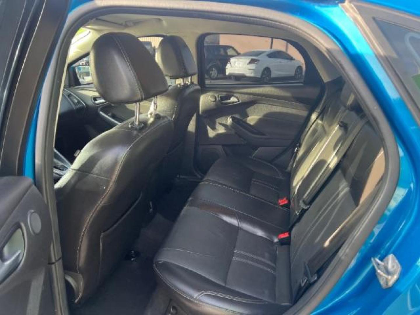 2014 Blue Candy Tinted CC /Charcoal Black Ford Focus Titanium Sedan (1FADP3J2XEL) with an 2.0L L4 DOHC 16V engine, 6-Speed Automatic transmission, located at 1865 East Red Hills Pkwy, St. George, 84770, (435) 628-0023, 37.120850, -113.543640 - We specialize in helping ALL people get the best financing available. No matter your credit score, good, bad or none we can get you an amazing rate. Had a bankruptcy, divorce, or repossessions? We give you the green light to get your credit back on the road. Low down and affordable payments that fit - Photo#21