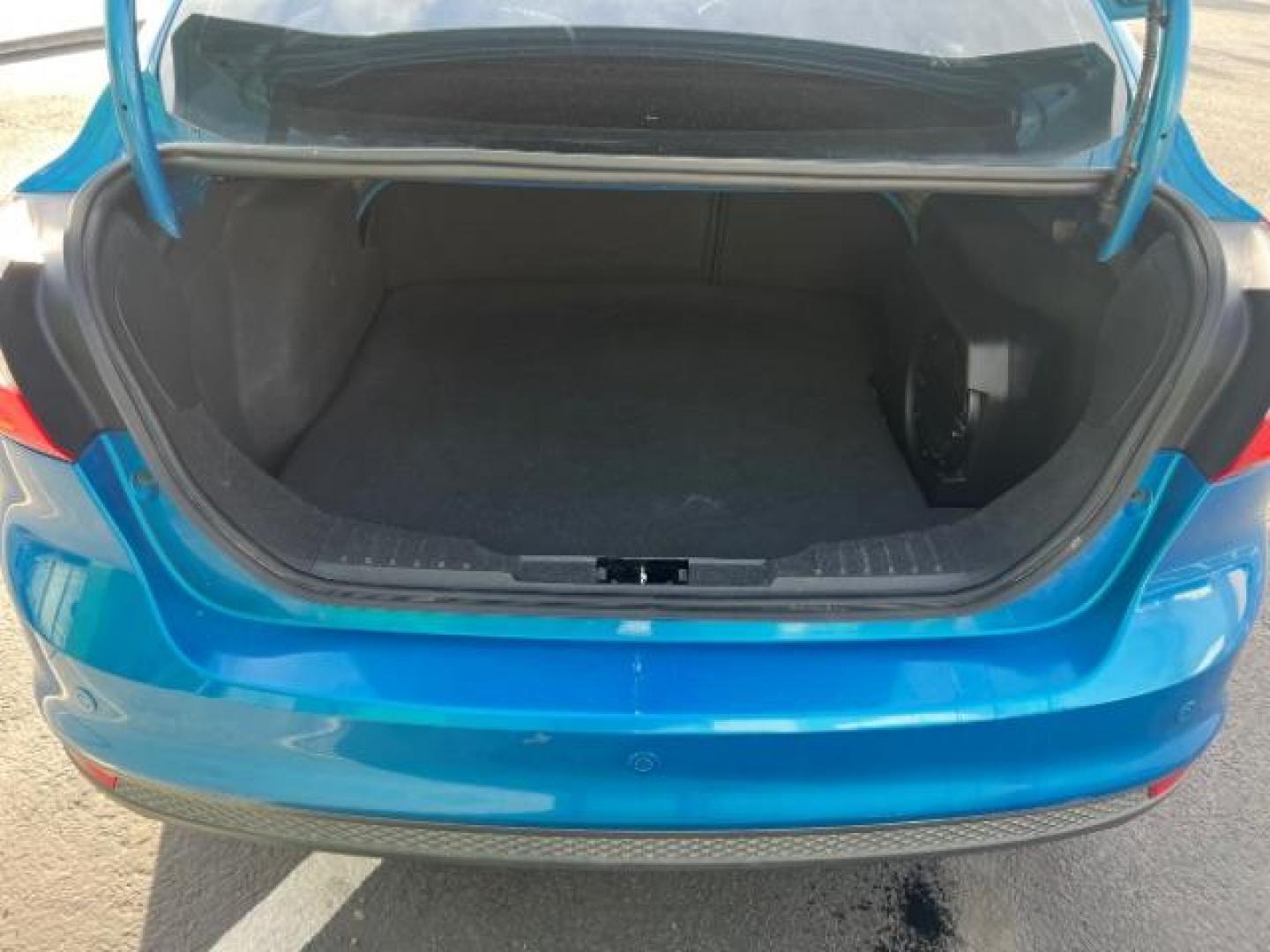 2014 Blue Candy Tinted CC /Charcoal Black Ford Focus Titanium Sedan (1FADP3J2XEL) with an 2.0L L4 DOHC 16V engine, 6-Speed Automatic transmission, located at 1865 East Red Hills Pkwy, St. George, 84770, (435) 628-0023, 37.120850, -113.543640 - We specialize in helping ALL people get the best financing available. No matter your credit score, good, bad or none we can get you an amazing rate. Had a bankruptcy, divorce, or repossessions? We give you the green light to get your credit back on the road. Low down and affordable payments that fit - Photo#24