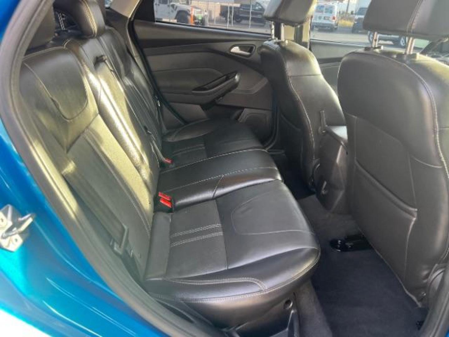 2014 Blue Candy Tinted CC /Charcoal Black Ford Focus Titanium Sedan (1FADP3J2XEL) with an 2.0L L4 DOHC 16V engine, 6-Speed Automatic transmission, located at 1865 East Red Hills Pkwy, St. George, 84770, (435) 628-0023, 37.120850, -113.543640 - We specialize in helping ALL people get the best financing available. No matter your credit score, good, bad or none we can get you an amazing rate. Had a bankruptcy, divorce, or repossessions? We give you the green light to get your credit back on the road. Low down and affordable payments that fit - Photo#26