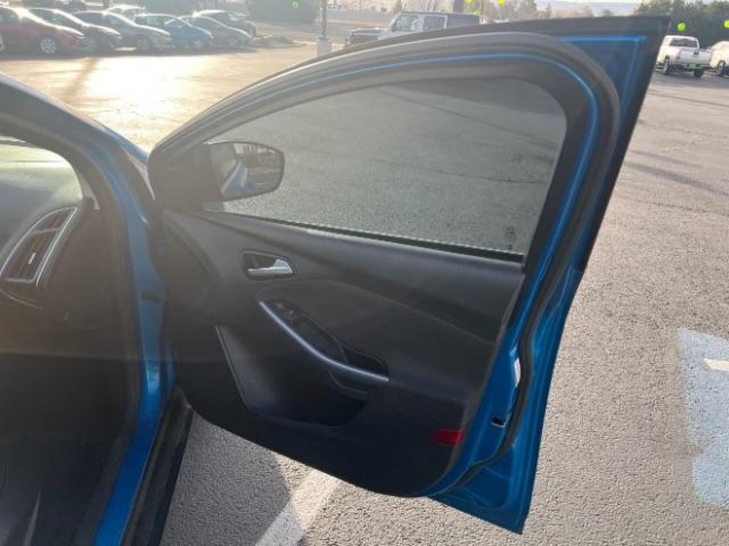 2014 Blue Candy Tinted CC /Charcoal Black Ford Focus Titanium Sedan (1FADP3J2XEL) with an 2.0L L4 DOHC 16V engine, 6-Speed Automatic transmission, located at 1865 East Red Hills Pkwy, St. George, 84770, (435) 628-0023, 37.120850, -113.543640 - We specialize in helping ALL people get the best financing available. No matter your credit score, good, bad or none we can get you an amazing rate. Had a bankruptcy, divorce, or repossessions? We give you the green light to get your credit back on the road. Low down and affordable payments that fit - Photo#27