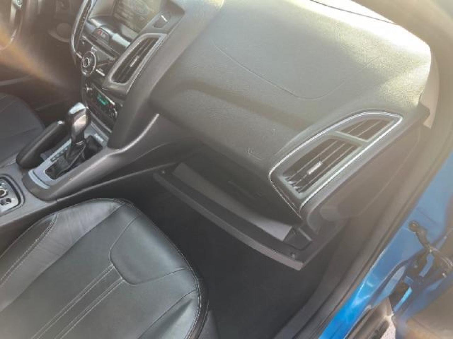 2014 Blue Candy Tinted CC /Charcoal Black Ford Focus Titanium Sedan (1FADP3J2XEL) with an 2.0L L4 DOHC 16V engine, 6-Speed Automatic transmission, located at 1865 East Red Hills Pkwy, St. George, 84770, (435) 628-0023, 37.120850, -113.543640 - We specialize in helping ALL people get the best financing available. No matter your credit score, good, bad or none we can get you an amazing rate. Had a bankruptcy, divorce, or repossessions? We give you the green light to get your credit back on the road. Low down and affordable payments that fit - Photo#29