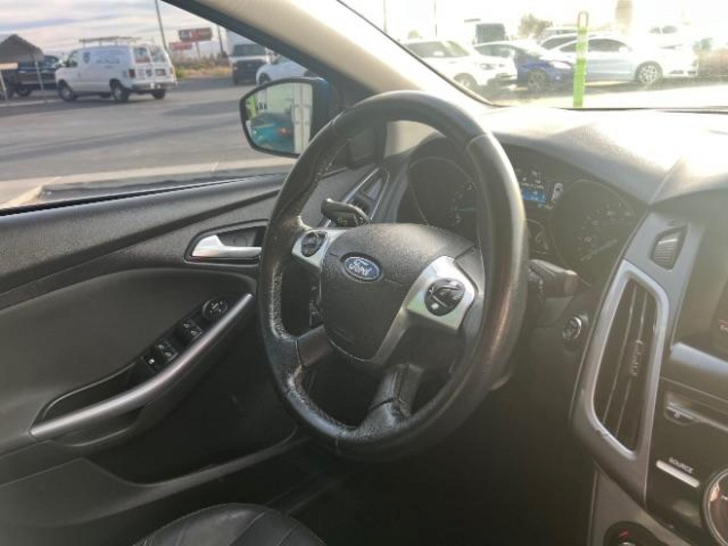 2014 Blue Candy Tinted CC /Charcoal Black Ford Focus Titanium Sedan (1FADP3J2XEL) with an 2.0L L4 DOHC 16V engine, 6-Speed Automatic transmission, located at 1865 East Red Hills Pkwy, St. George, 84770, (435) 628-0023, 37.120850, -113.543640 - We specialize in helping ALL people get the best financing available. No matter your credit score, good, bad or none we can get you an amazing rate. Had a bankruptcy, divorce, or repossessions? We give you the green light to get your credit back on the road. Low down and affordable payments that fit - Photo#30