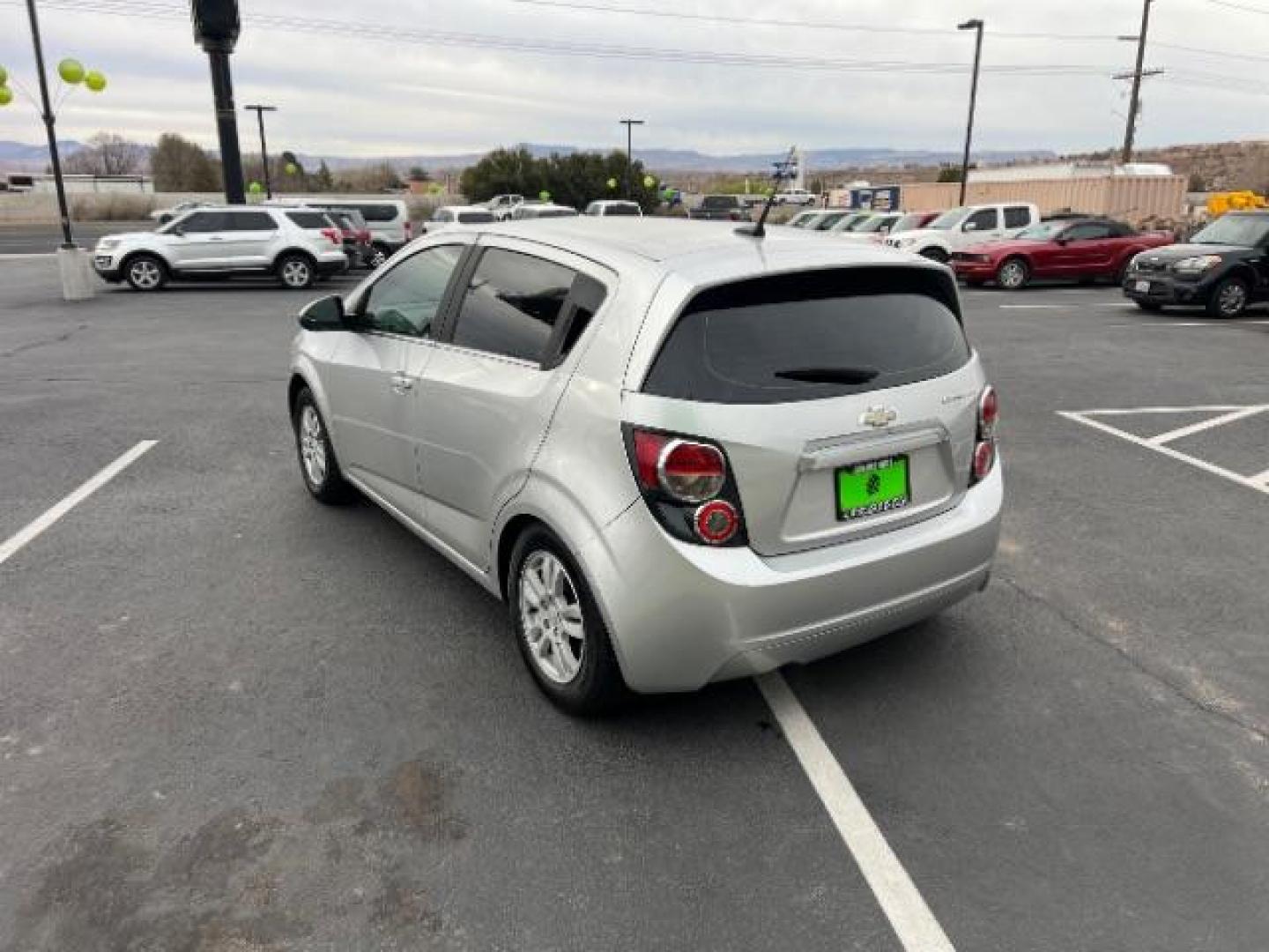 2014 Silver Ice Metallic /Dark Pewter/Dark Titanium Chevrolet Sonic LT Auto 5-Door (1G1JC6SH0E4) with an 1.8L L4 DOHC 24V engine, 6-Speed Automatic transmission, located at 940 North Main Street, Cedar City, UT, 84720, (435) 628-0023, 37.692936, -113.061897 - Photo#4