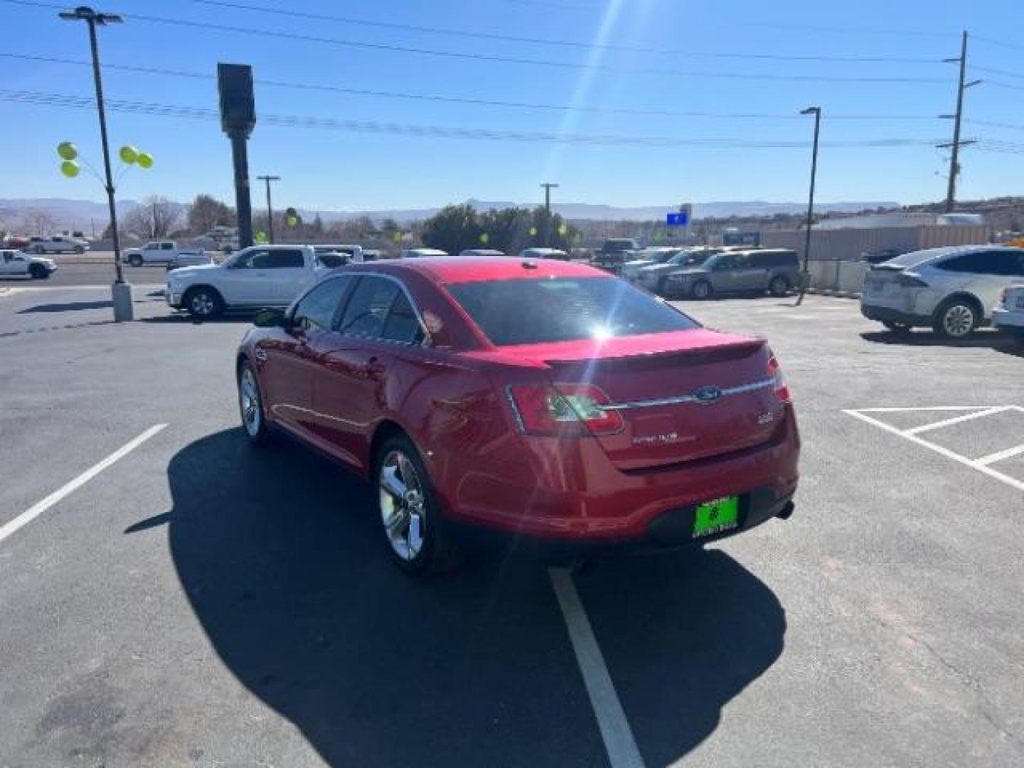 2010 Candy Red Metallic Paint /Charcoal Black Leather Interior Ford Taurus SHO AWD (1FAHP2KT5AG) with an 3.5L V6 DOHC 24V engine, 6-Speed Automatic transmission, located at 940 North Main Street, Cedar City, UT, 84720, (435) 628-0023, 37.692936, -113.061897 - We specialize in helping ALL people get the best financing available. No matter your credit score, good, bad or none we can get you an amazing rate. Had a bankruptcy, divorce, or repossessions? We give you the green light to get your credit back on the road. Low down and affordable payments that fit - Photo#4