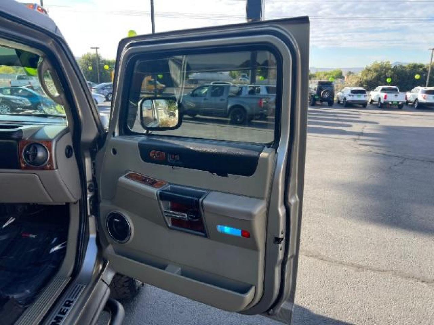 2003 Pewter Metallic /Wheat Leather Interior Hummer H2 Sport Utility (5GRGN23U73H) with an 6.0L V8 OHV 16V engine, 4-Speed Automatic transmission, located at 1865 East Red Hills Pkwy, St. George, 84770, (435) 628-0023, 37.120850, -113.543640 - Versatile Southern Utah travel starts with this 2003 Hummer H2 Sport Utility. Its 6.0L V8, 4-speed automatic transmission, and full-time four-wheel drive make it a smart fit for off-road trails, towing, and weekend adventures. With 142,613 miles, this H2 is ready for its next adventure. The Sport U- Photo#28