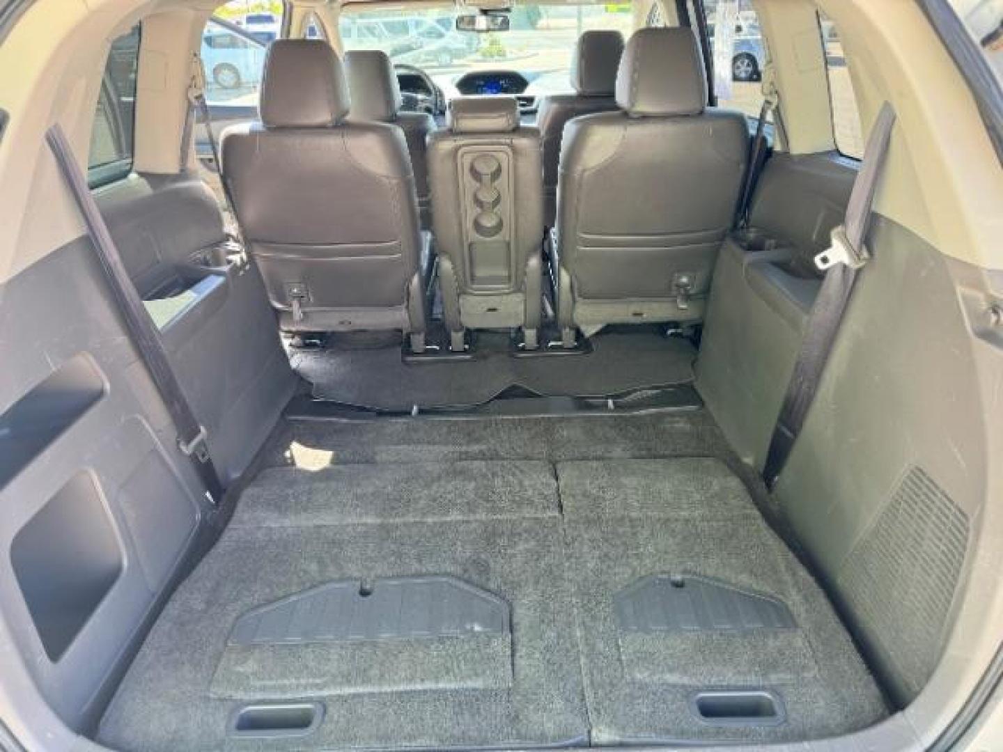 2014 Alabaster Silver Metallic /Beige Honda Odyssey EX-L (5FNRL5H62EB) with an 3.5L V6 SOHC 24V engine, 6-Speed Automatic transmission, located at 1865 East Red Hills Pkwy, St. George, 84770, (435) 628-0023, 37.120850, -113.543640 - We specialize in helping ALL people get the best financing available. No matter your credit score, good, bad or none we can get you an amazing rate. Had a bankruptcy, divorce, or repossessions? We give you the green light to get your credit back on the road. Low down and affordable payments that fit - Photo#29