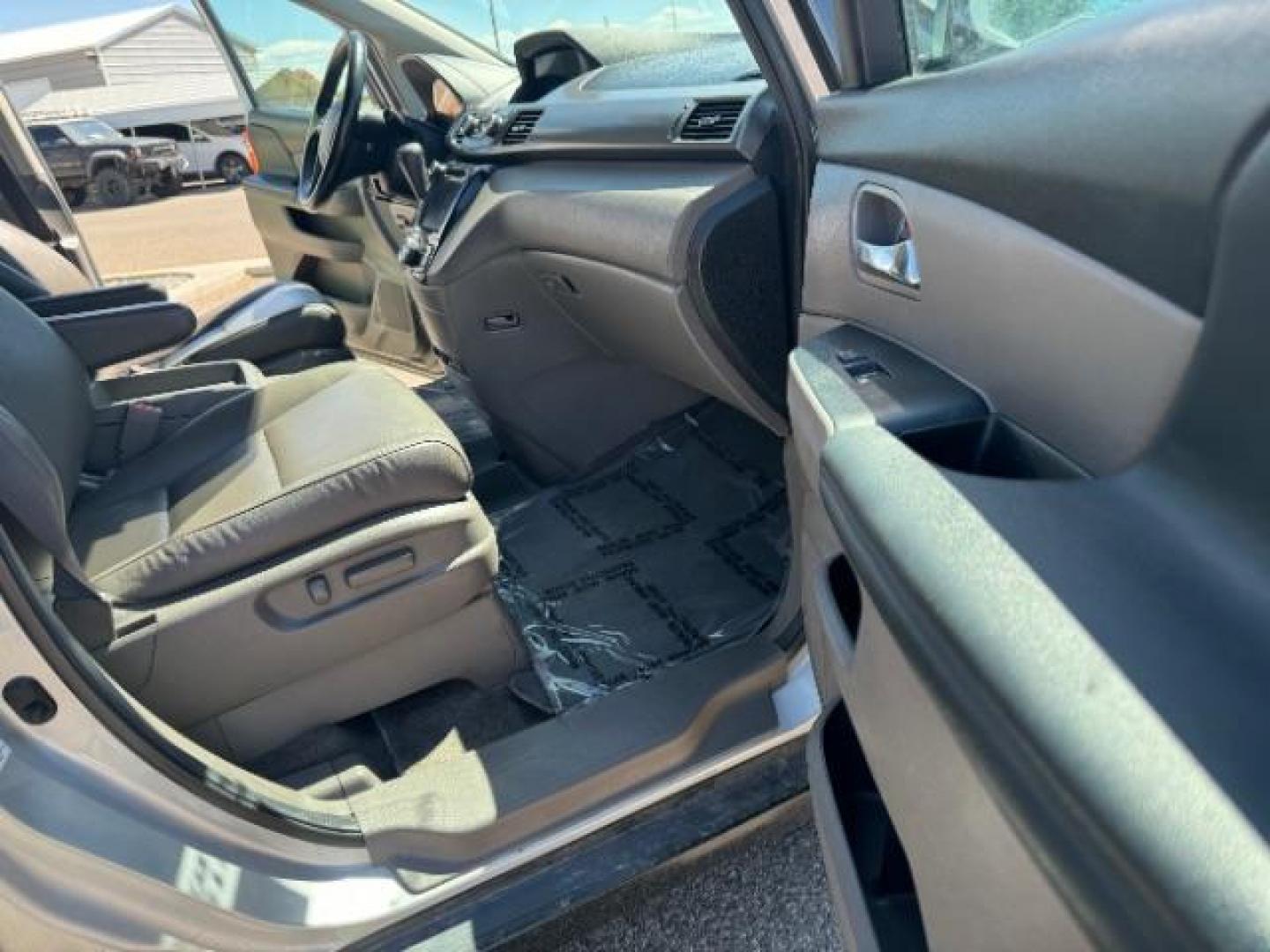 2014 Alabaster Silver Metallic /Beige Honda Odyssey EX-L (5FNRL5H62EB) with an 3.5L V6 SOHC 24V engine, 6-Speed Automatic transmission, located at 1865 East Red Hills Pkwy, St. George, 84770, (435) 628-0023, 37.120850, -113.543640 - We specialize in helping ALL people get the best financing available. No matter your credit score, good, bad or none we can get you an amazing rate. Had a bankruptcy, divorce, or repossessions? We give you the green light to get your credit back on the road. Low down and affordable payments that fit - Photo#35