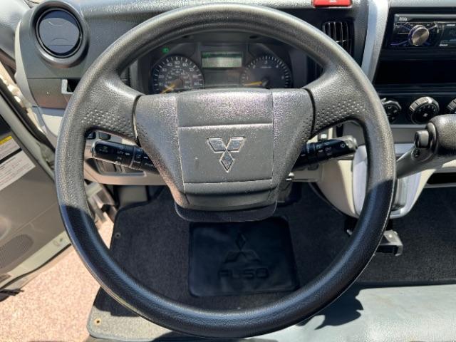 2020 White /Black Mitsubishi Fuso FE180 (4UZCXE119LG) with an 6L engine, Automatic transmission, located at 1865 East Red Hills Pkwy, St. George, 84770, (435) 628-0023, 37.120850, -113.543640 - Fuso FE180 dump truck. 26k miles. Runs a drives great! FE180 Dump Truck is a powerful and versatile commercial vehicle with a GVWR of 17,995 pounds. It is powered by the GMC 6.0L turbocharged V8 gas engine paired with an Allison 6-speed automatic transmission. Standard features include air conditi - Photo#18